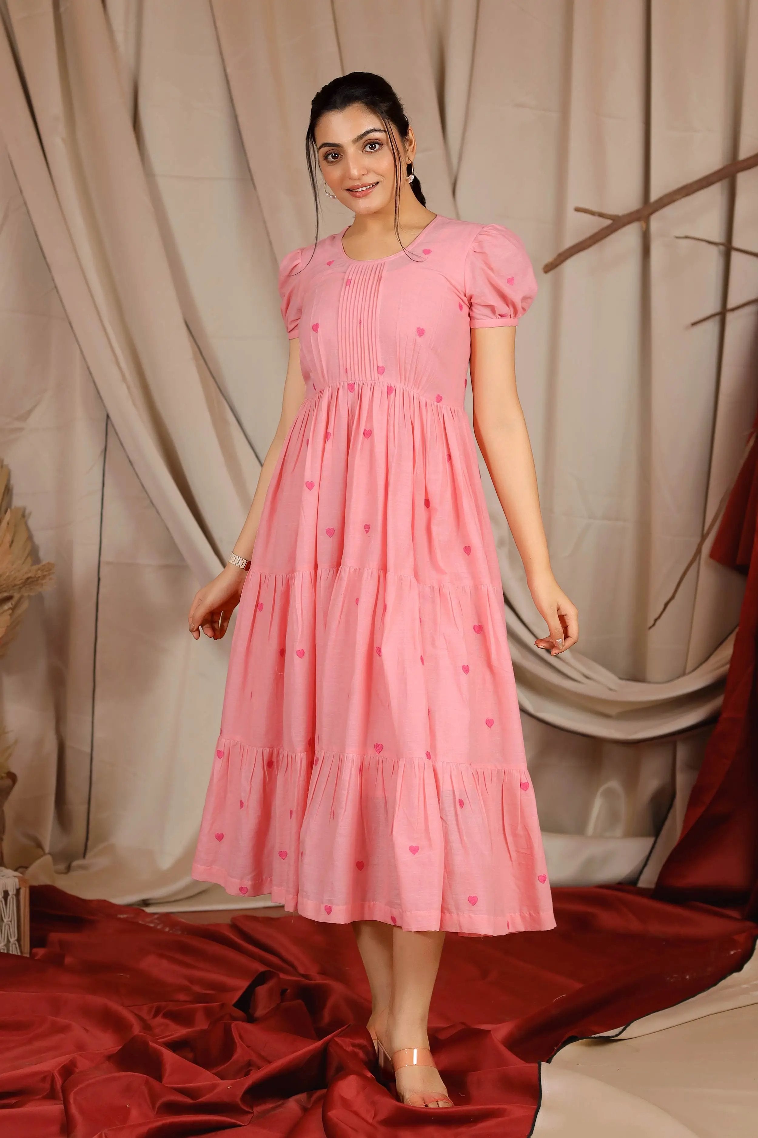a woman in pink cotton long dress
