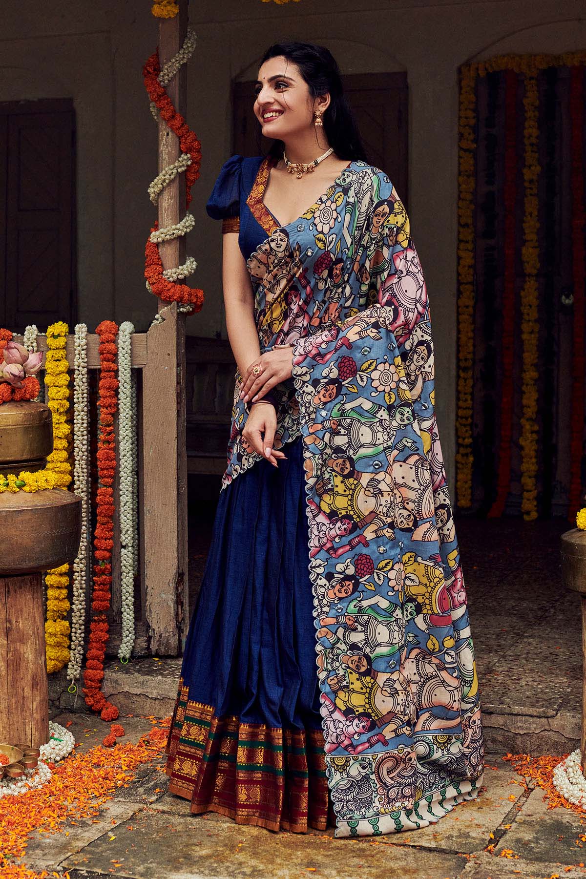 a woman in Blue lehenga set