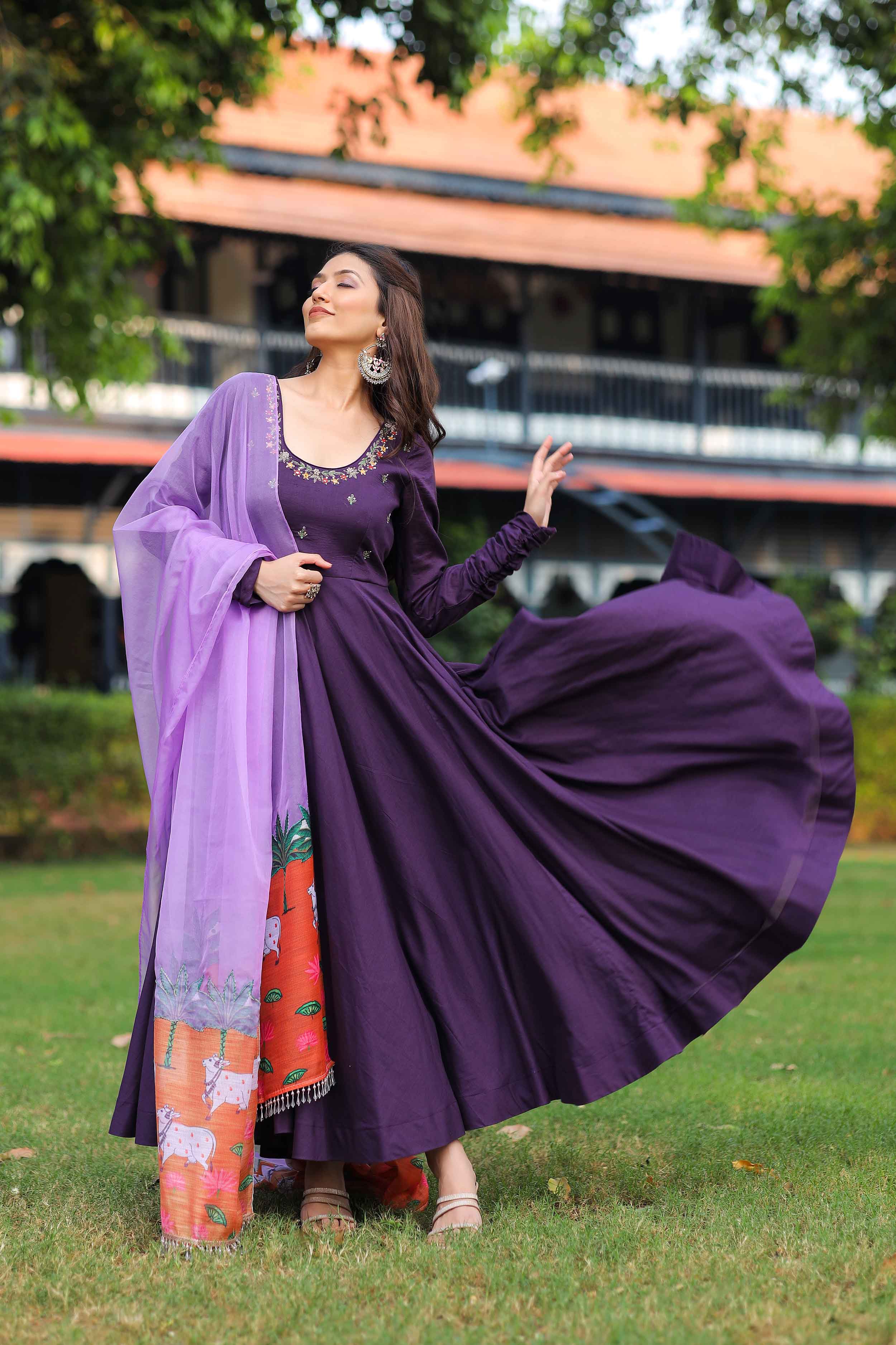 a woman in burgundy anarkali dress