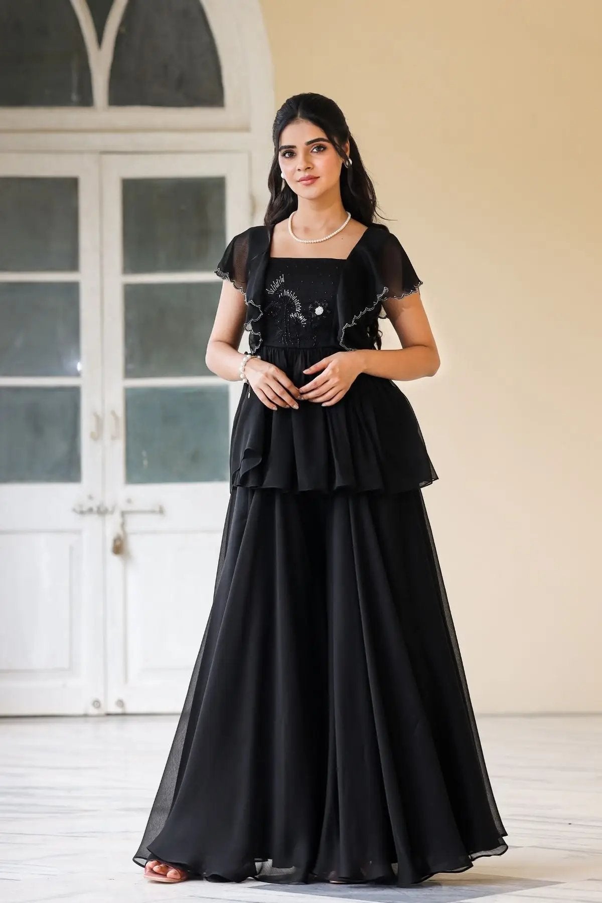 Exclusive Celestial Indo Western ethnic dress in black with layered design and intricate embroidery, perfect for traditional and ceremonial occasions.