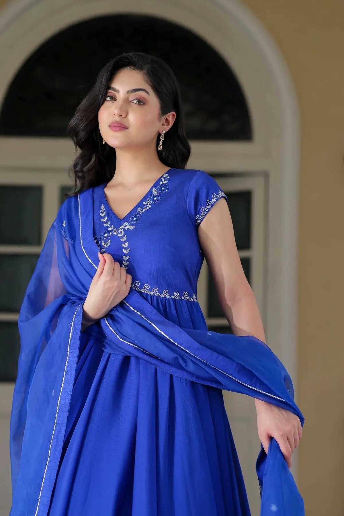 Model wearing Charul Opal Anarkali in royal blue with dupatta