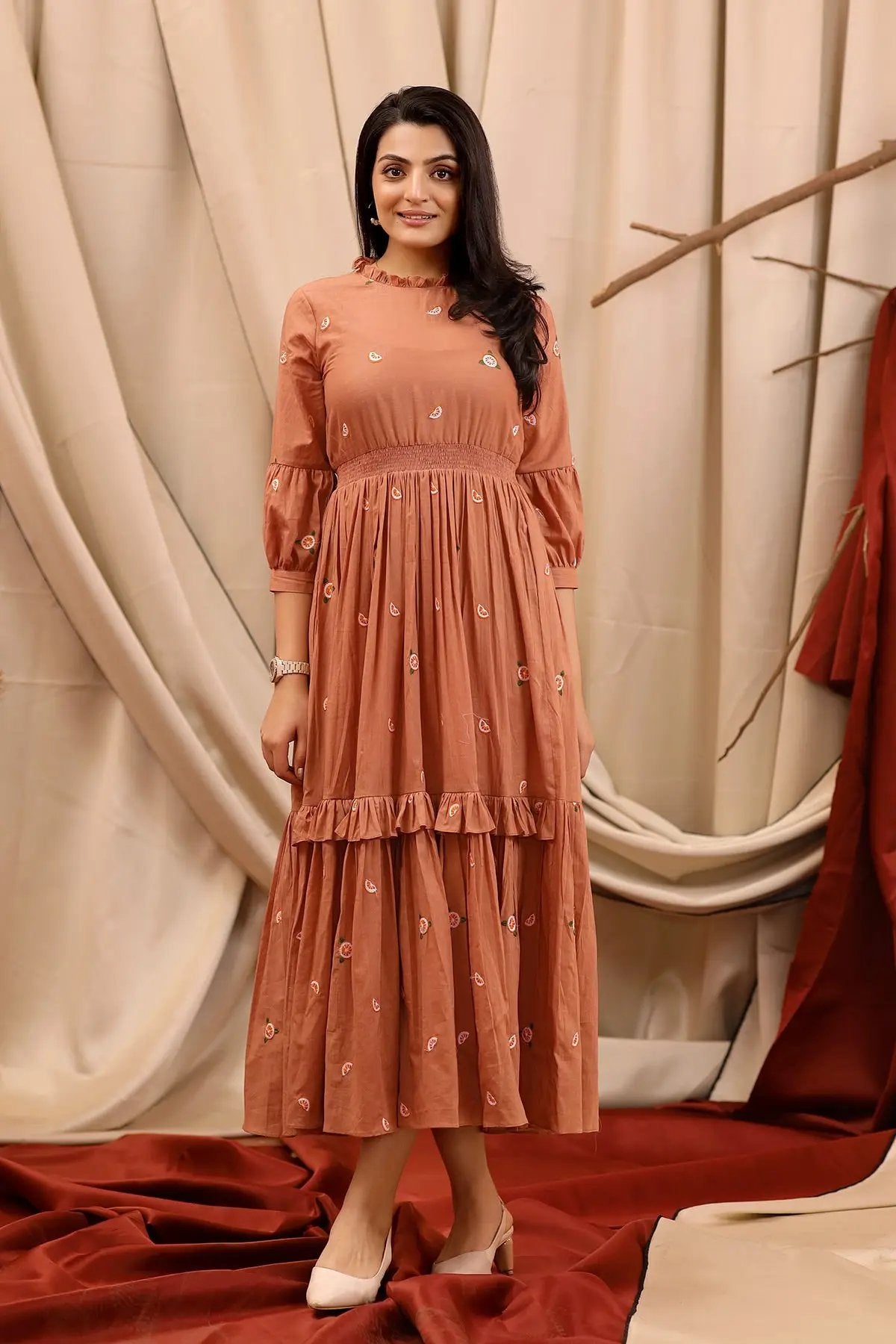 a woman in brown cotton long dress