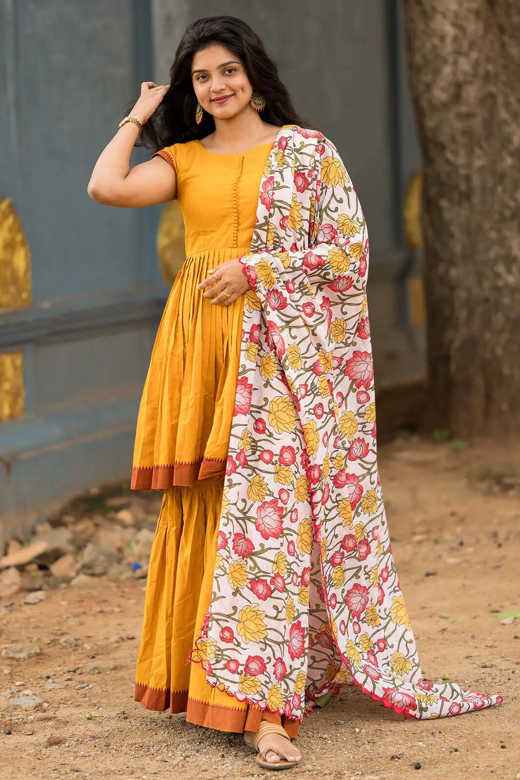 Yellow Deepika Sharara Set with floral dupatta, casual pose