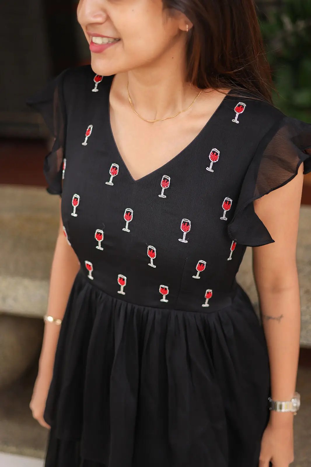 Close-up of Gothic Black Midi Dress with wine glass embroidery