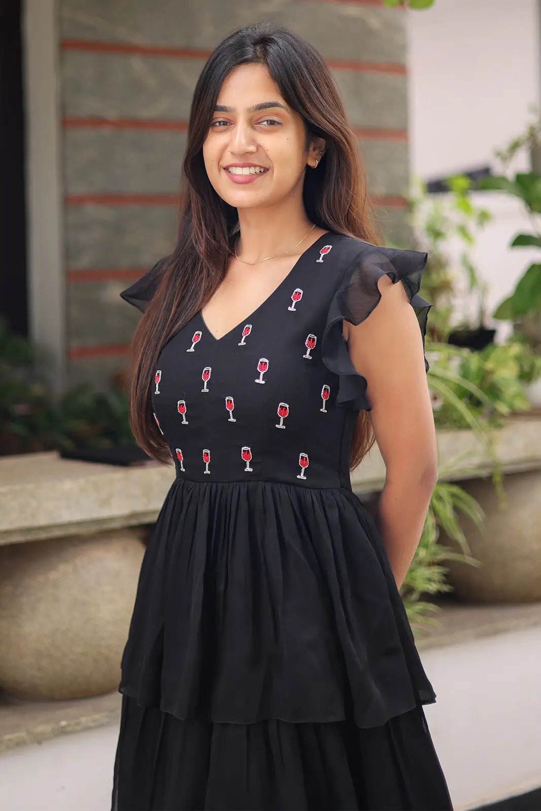 Side view of Gothic Black Midi Dress with ruffled sleeves