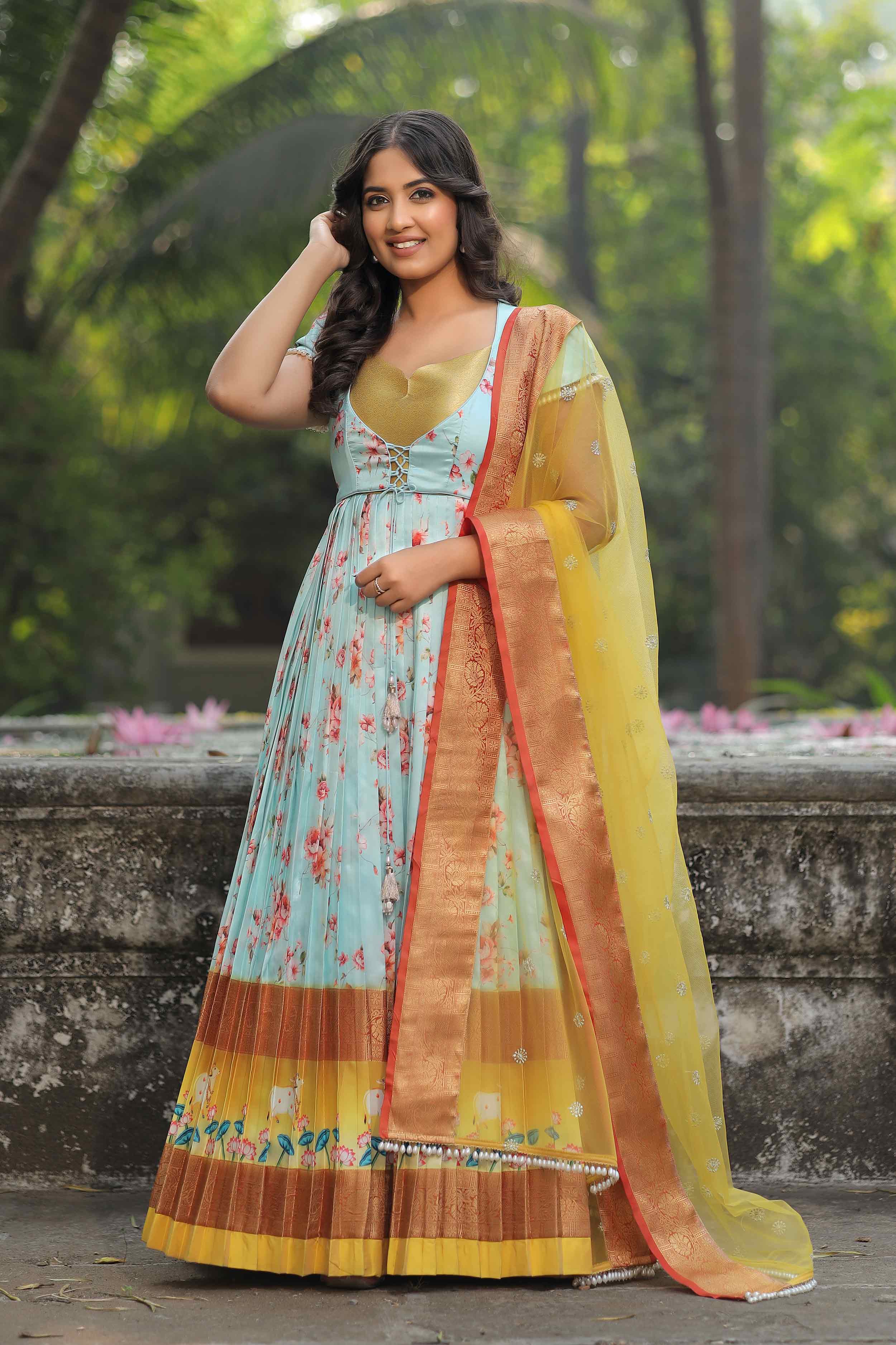 Model wearing Iris Floral Pichwai Silk Dress outdoors