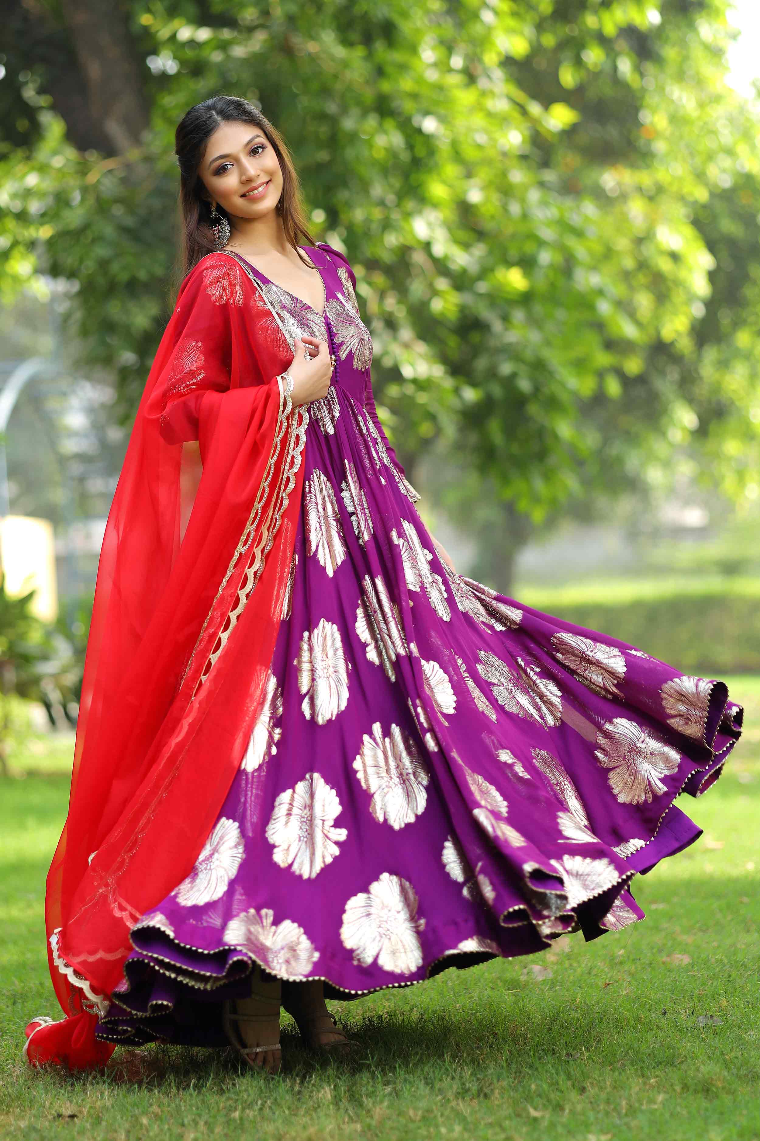 a woman in purple dress and red dupatta