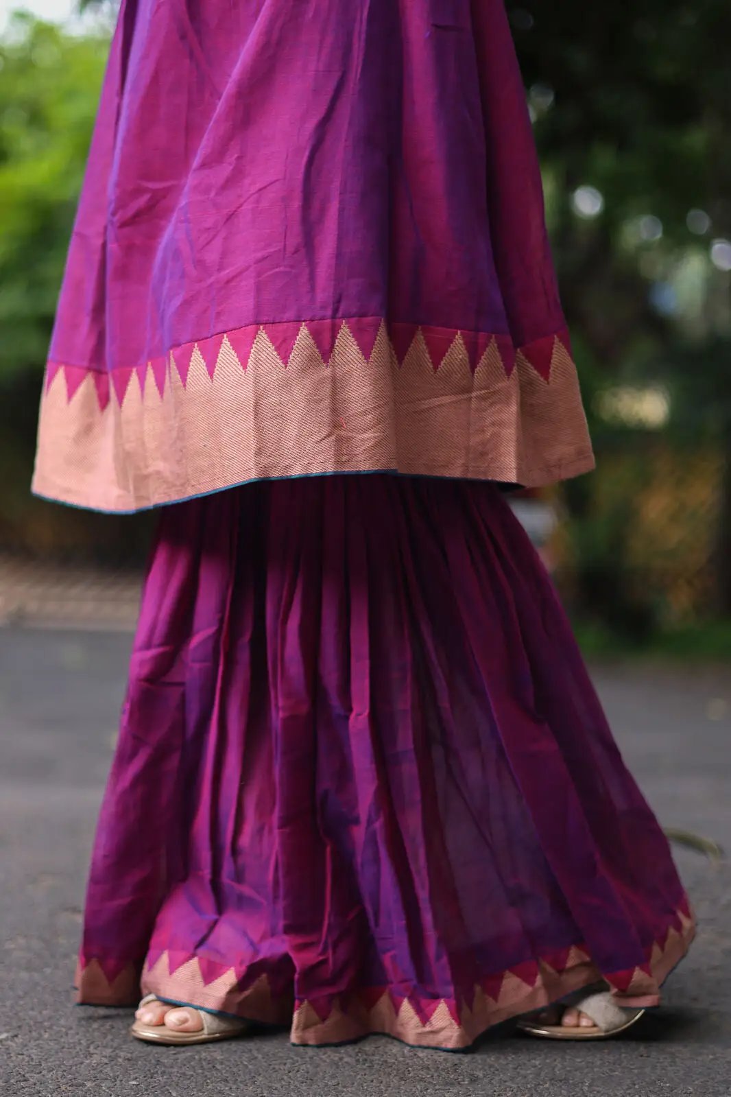 Close-up of purple sharara pants with border design