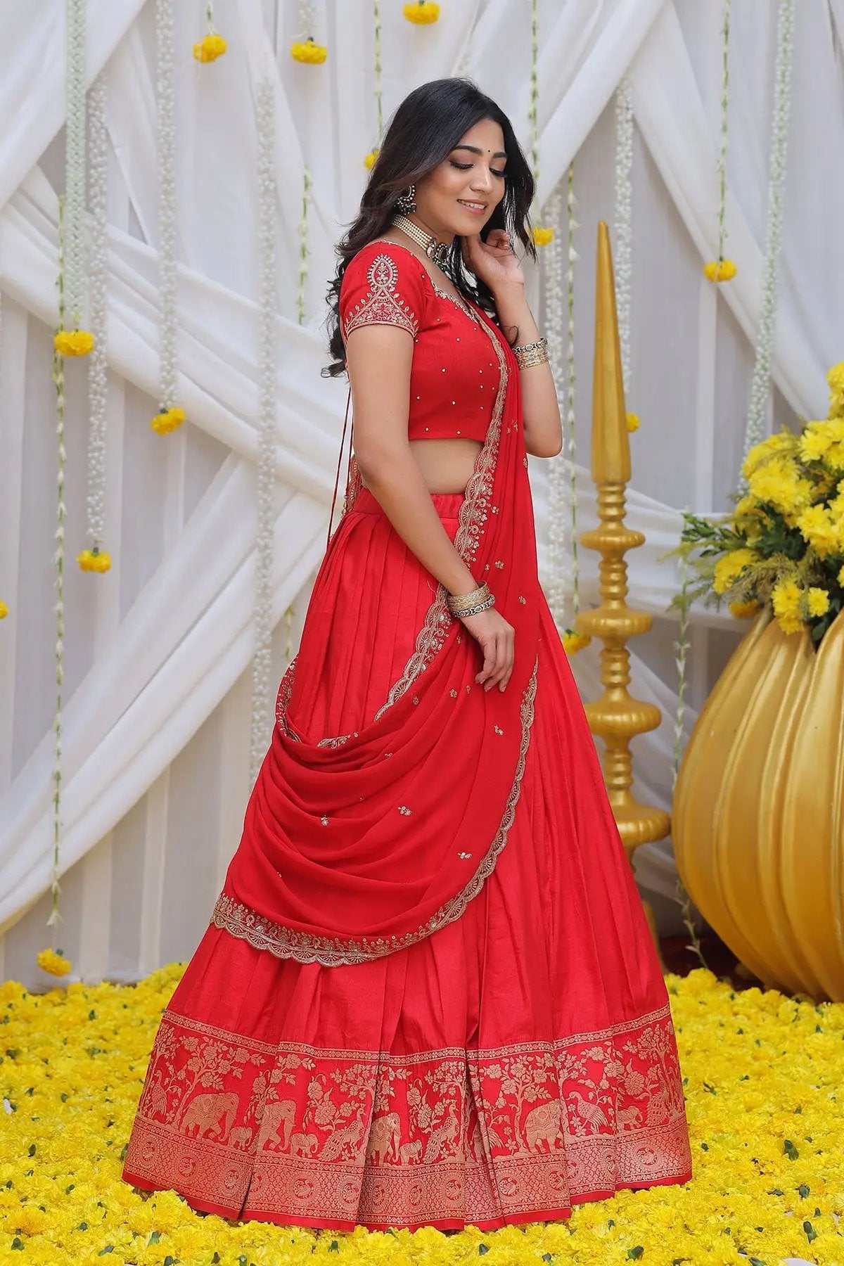 a woman in red pattu saree