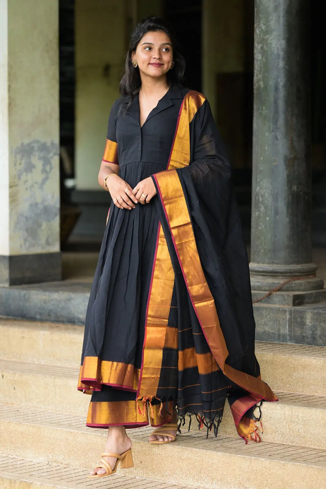 Malini Handloom Suit Set in black with gold border