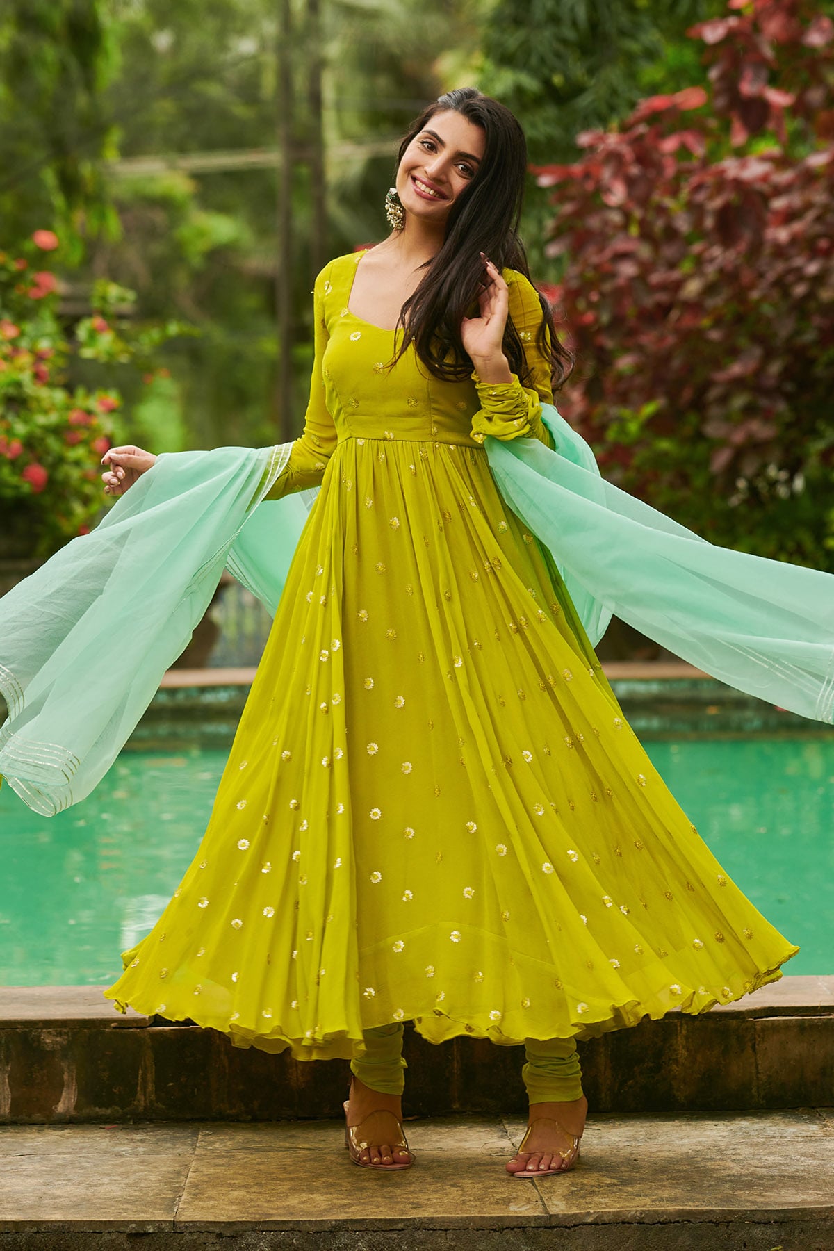 a woman in lime and aqua Anarkali suit