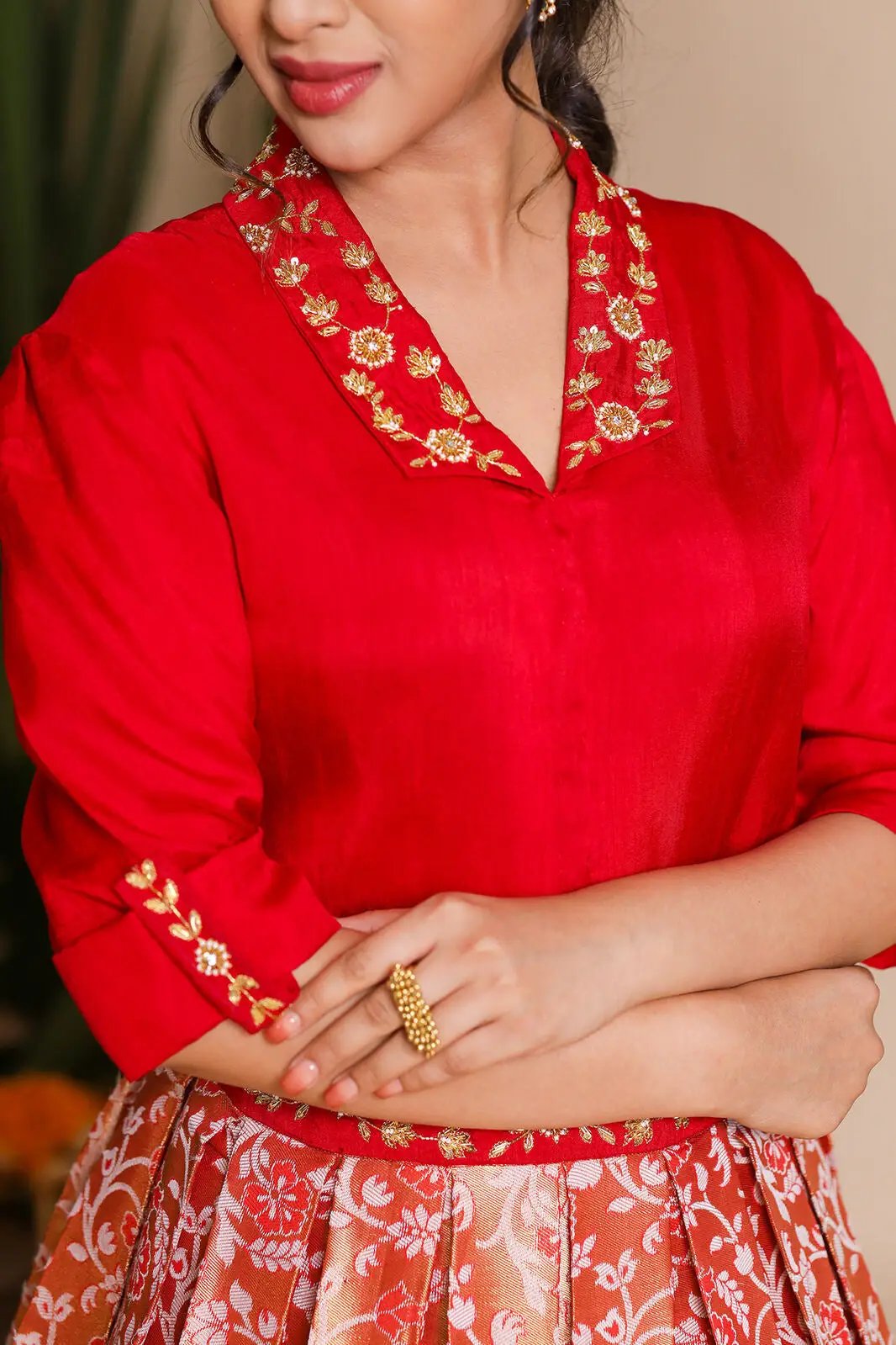 Close-up of Meera Indo Western red lehenga embroidery