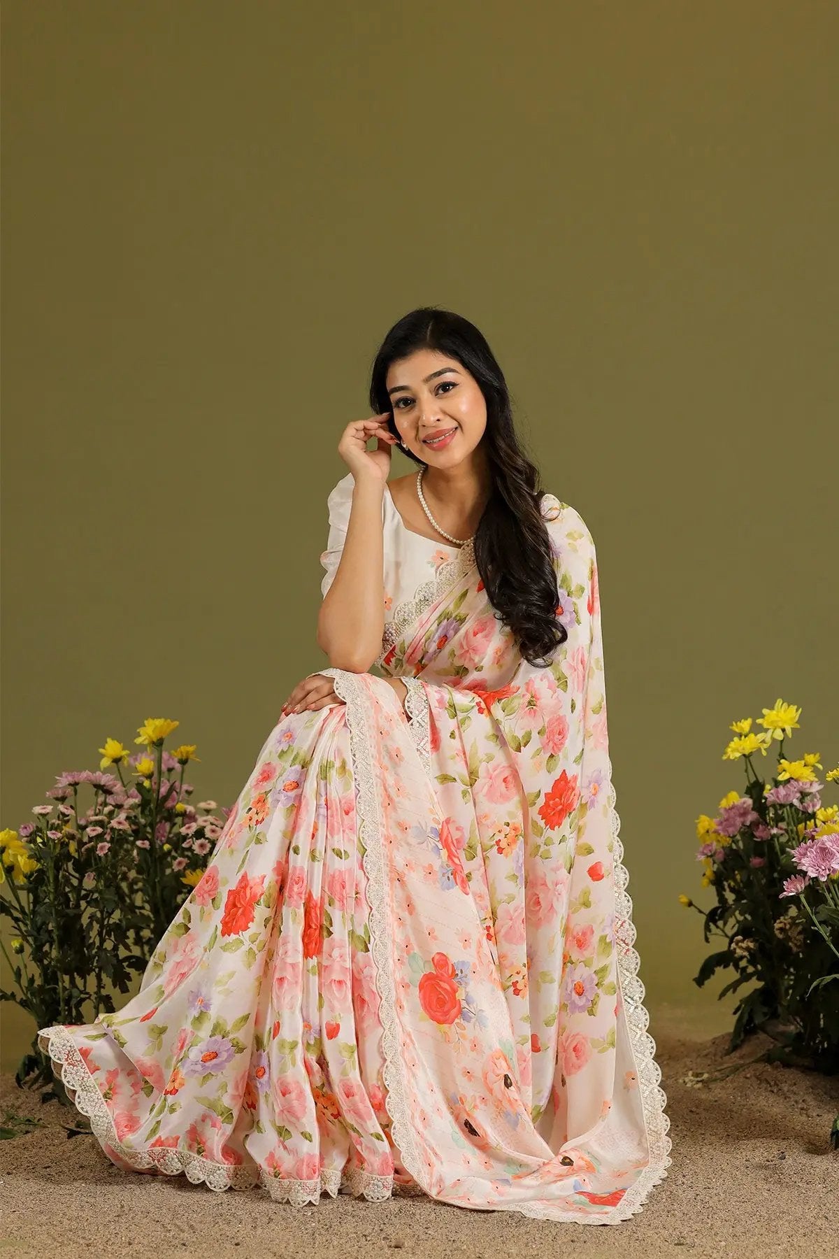 a woman in ivory printed saree