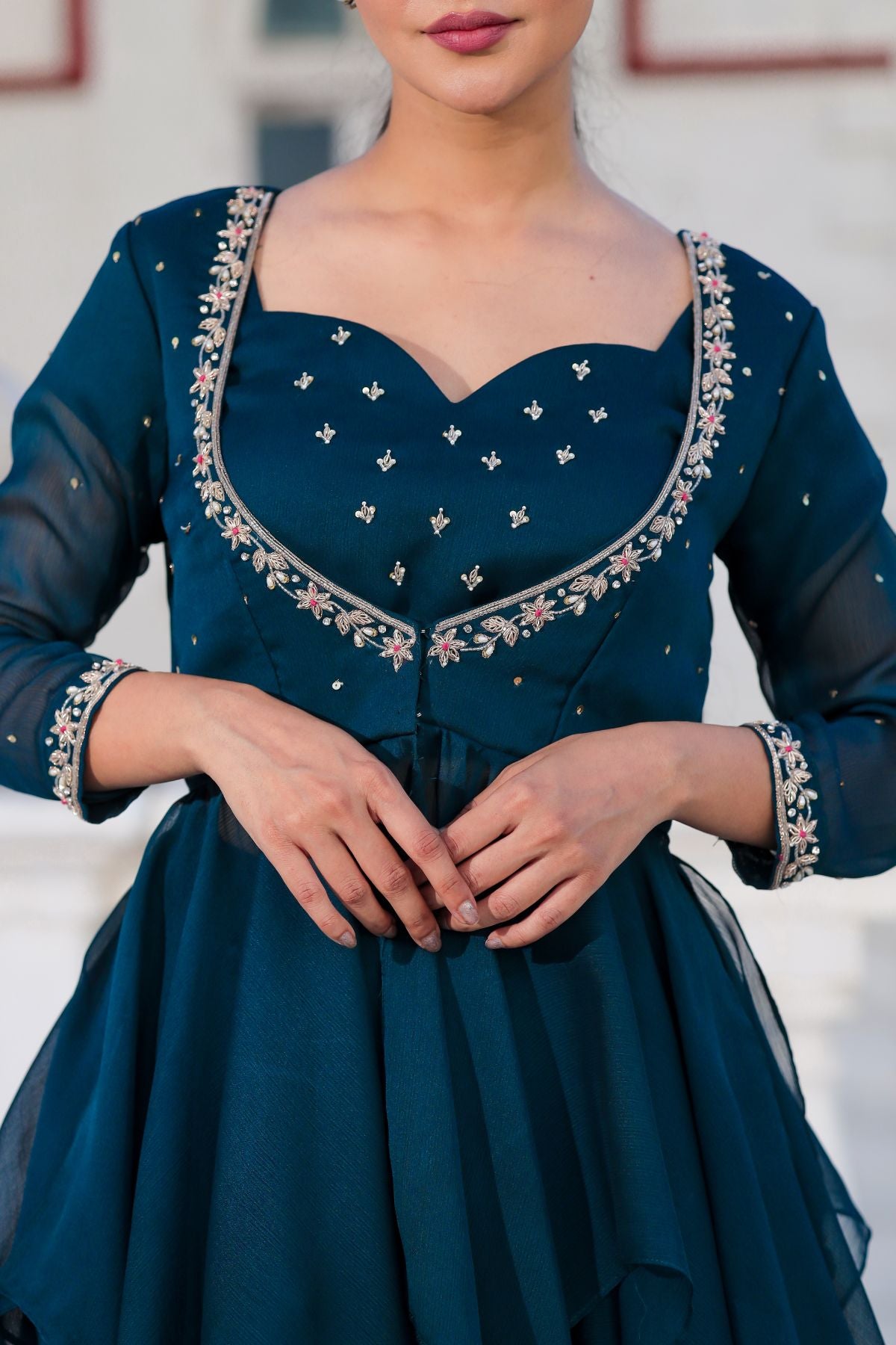 Detailed embroidery on Peacock Majesty dress bodice