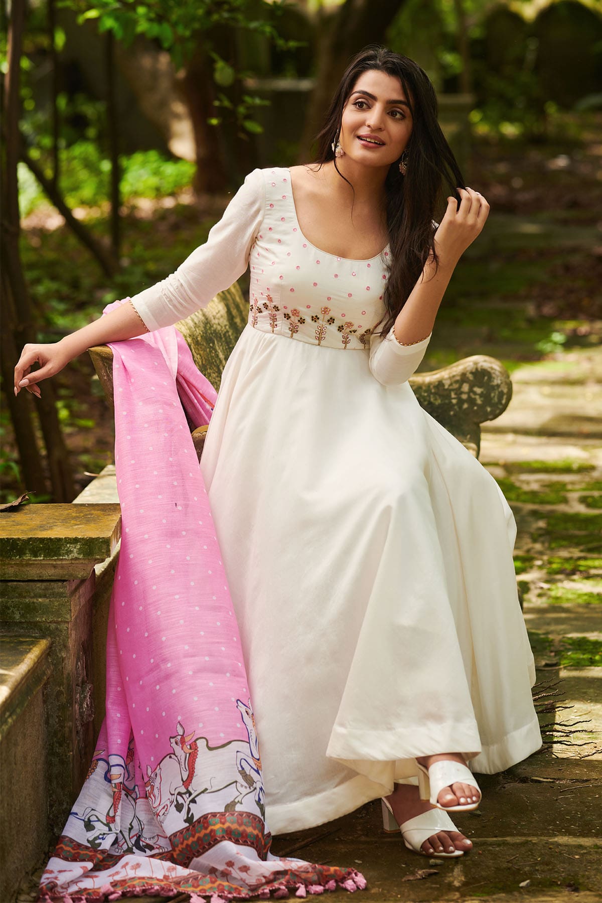 a woman in white suit