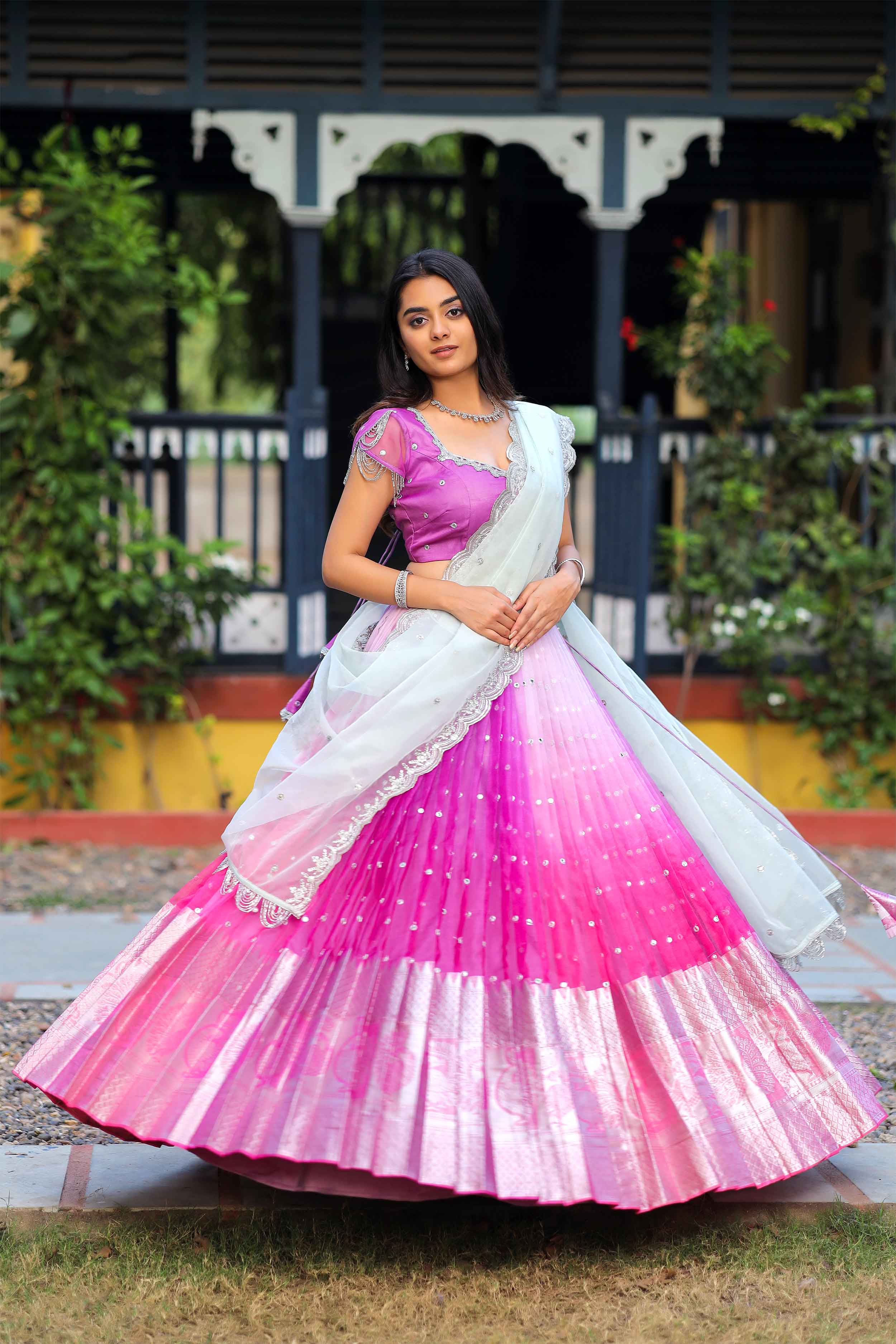 a woman in pink lehenga suits