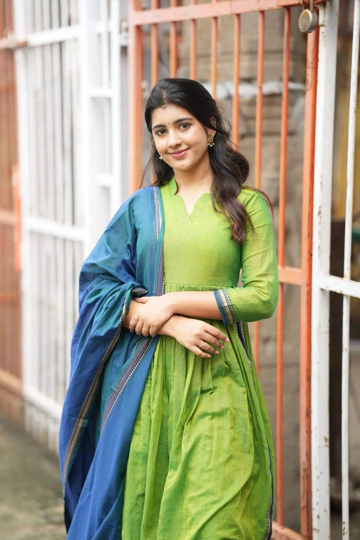 Elegant Punaam Kurta Set in green with a blue dupatta, styled for a traditional look, perfect for ceremonial occasions.