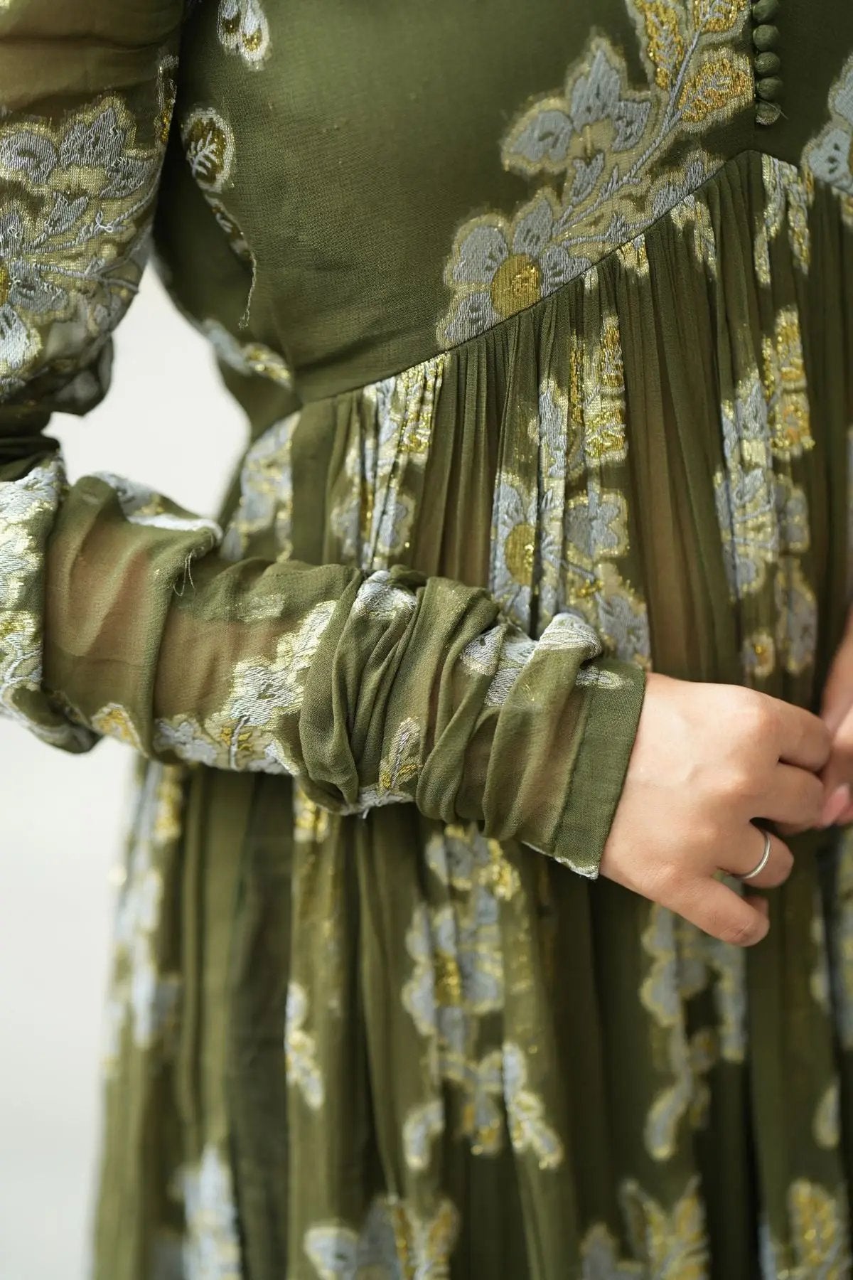 Close-up of the Maahi Kurta Set in Olive showcasing intricate floral embroidery on sheer fabric with ruched sleeve detailing.