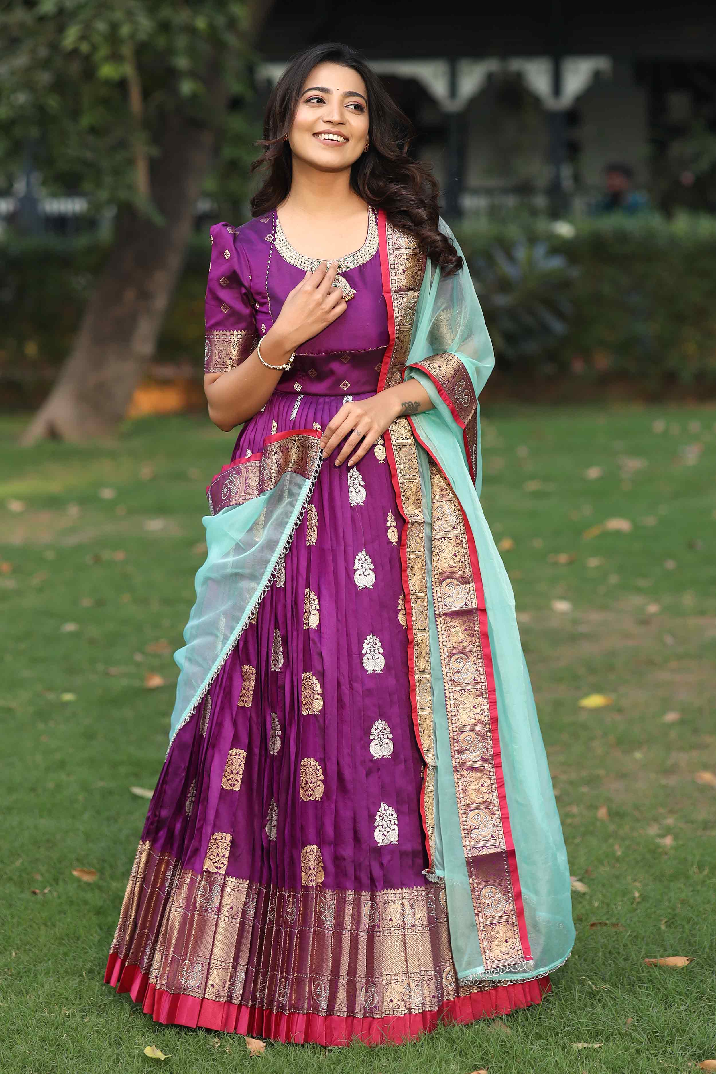 a woman in purple anarkali dress