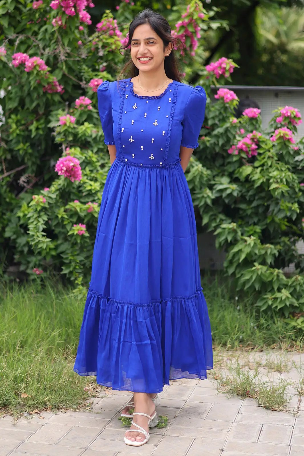 Raaya Chinnon Midi Dress in Royal Blue, garden setting