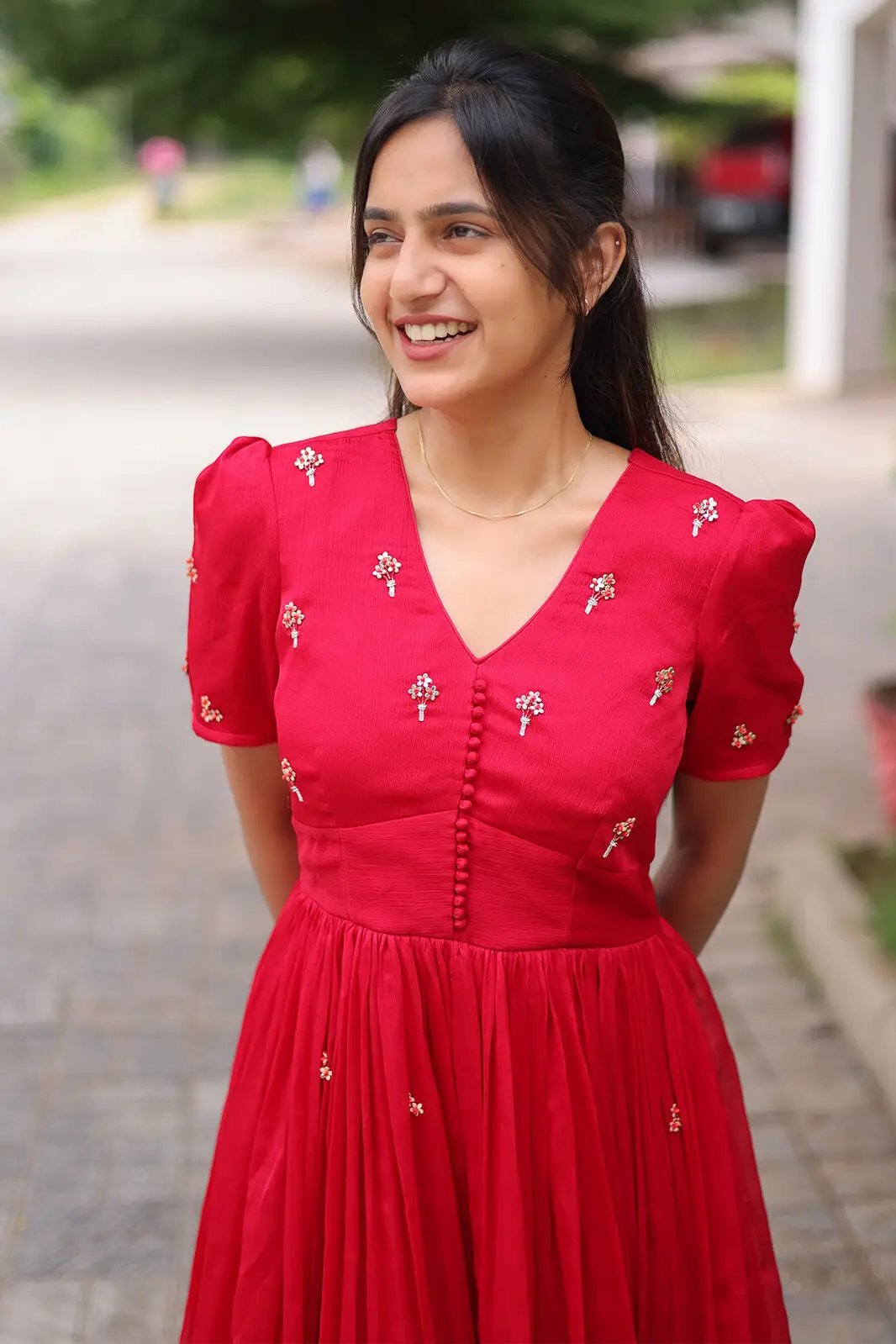 Model smiling in Radiant Ruby Midi Dress