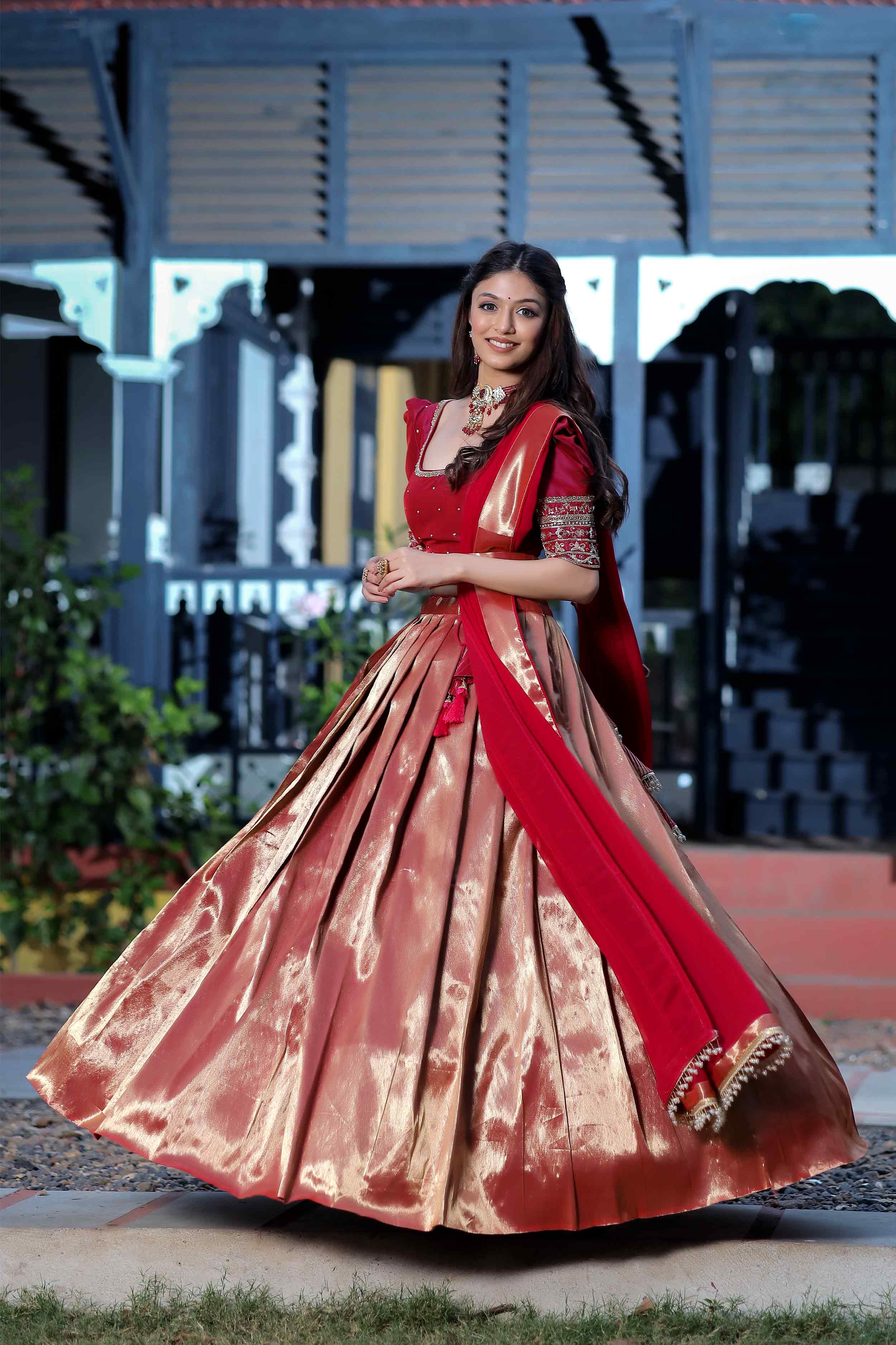 a woman in Red Half Saree