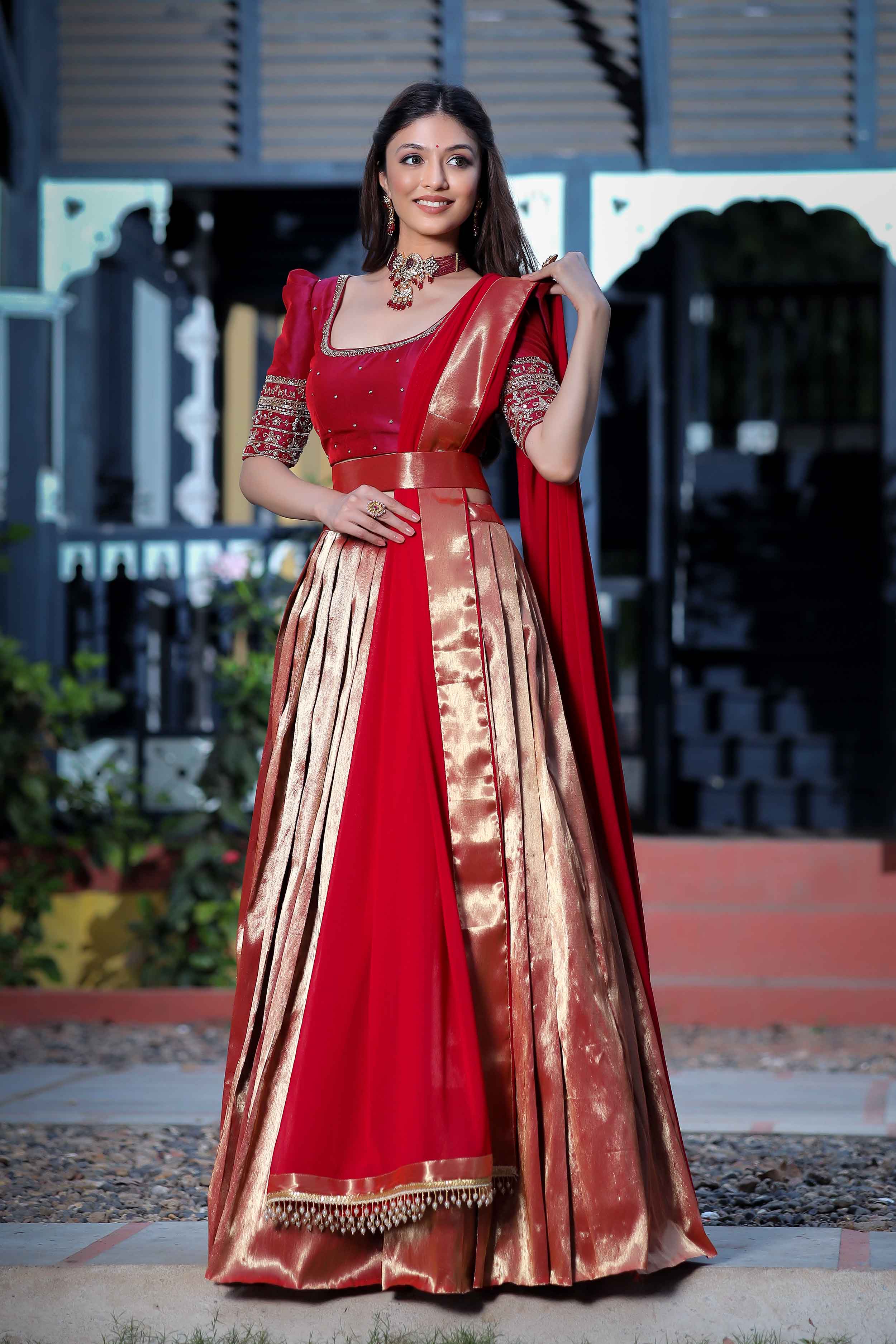 a woman in Red Pattu Pavadai