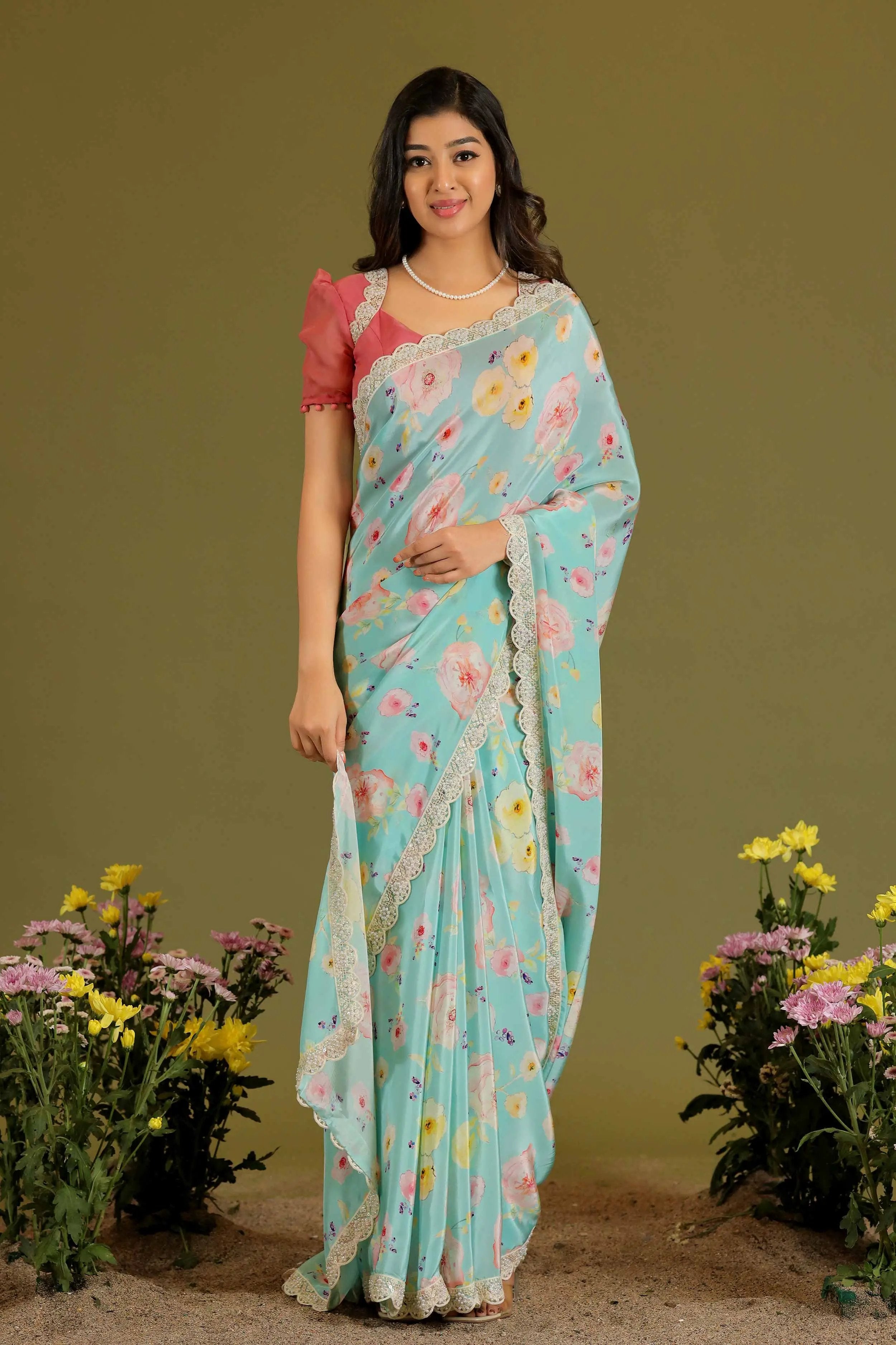 a woman in pink and blue Saree - Bullionknot