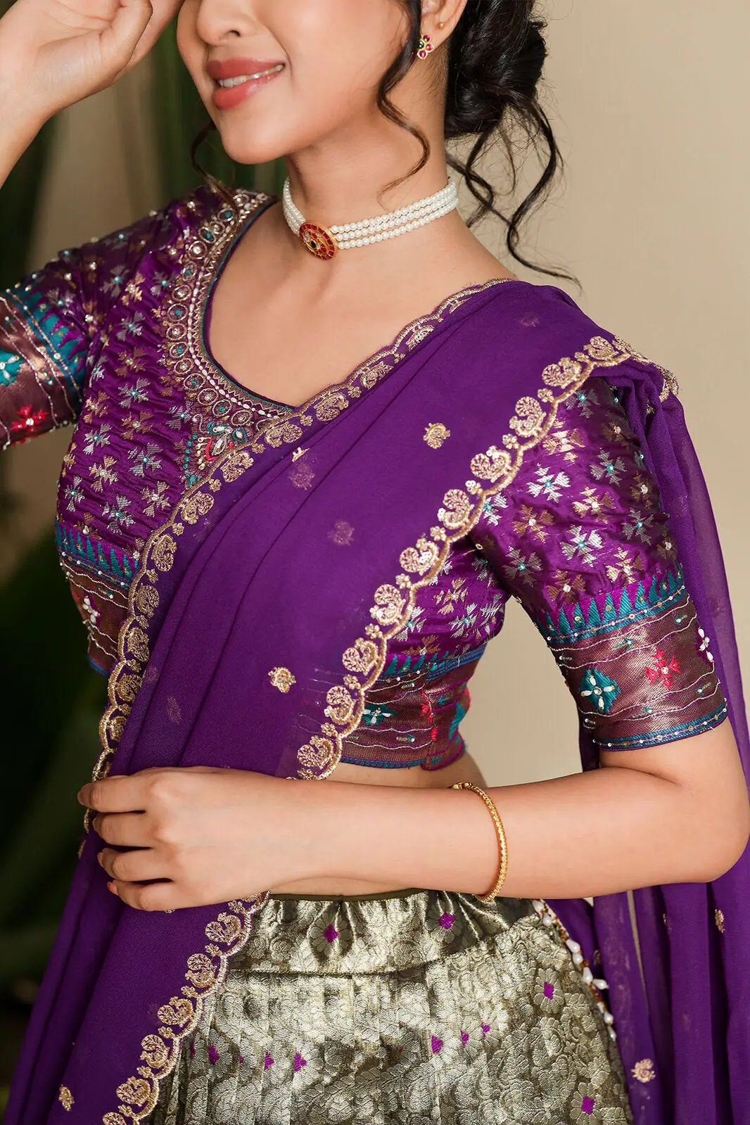 Close-up of Shreshtha purple lehenga blouse and dupatta