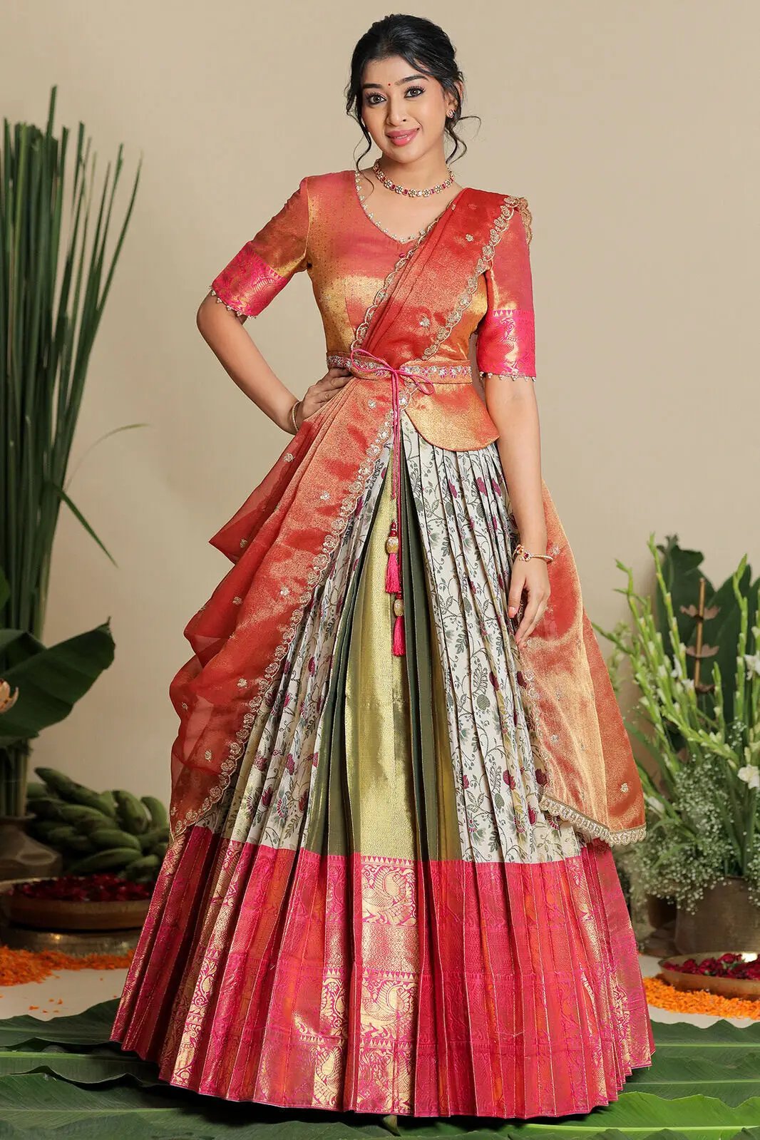 Elegant ivory lehenga with pink and gold details