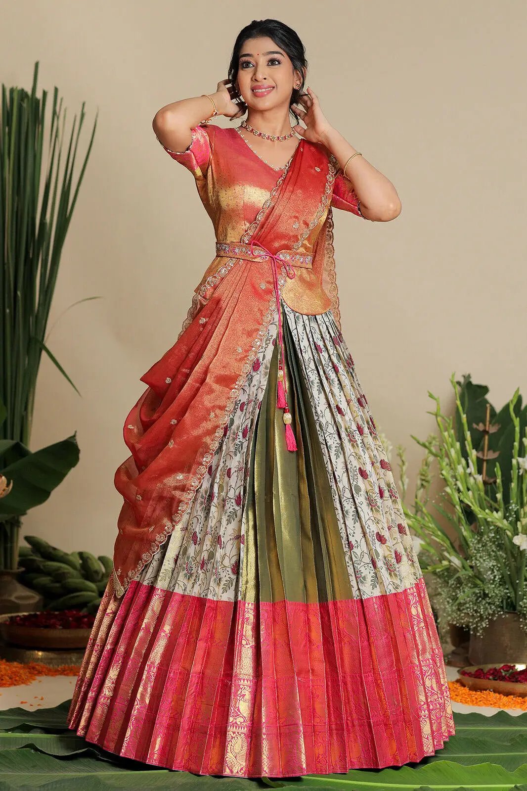 Ivory lehenga set with pink border and floral patterns