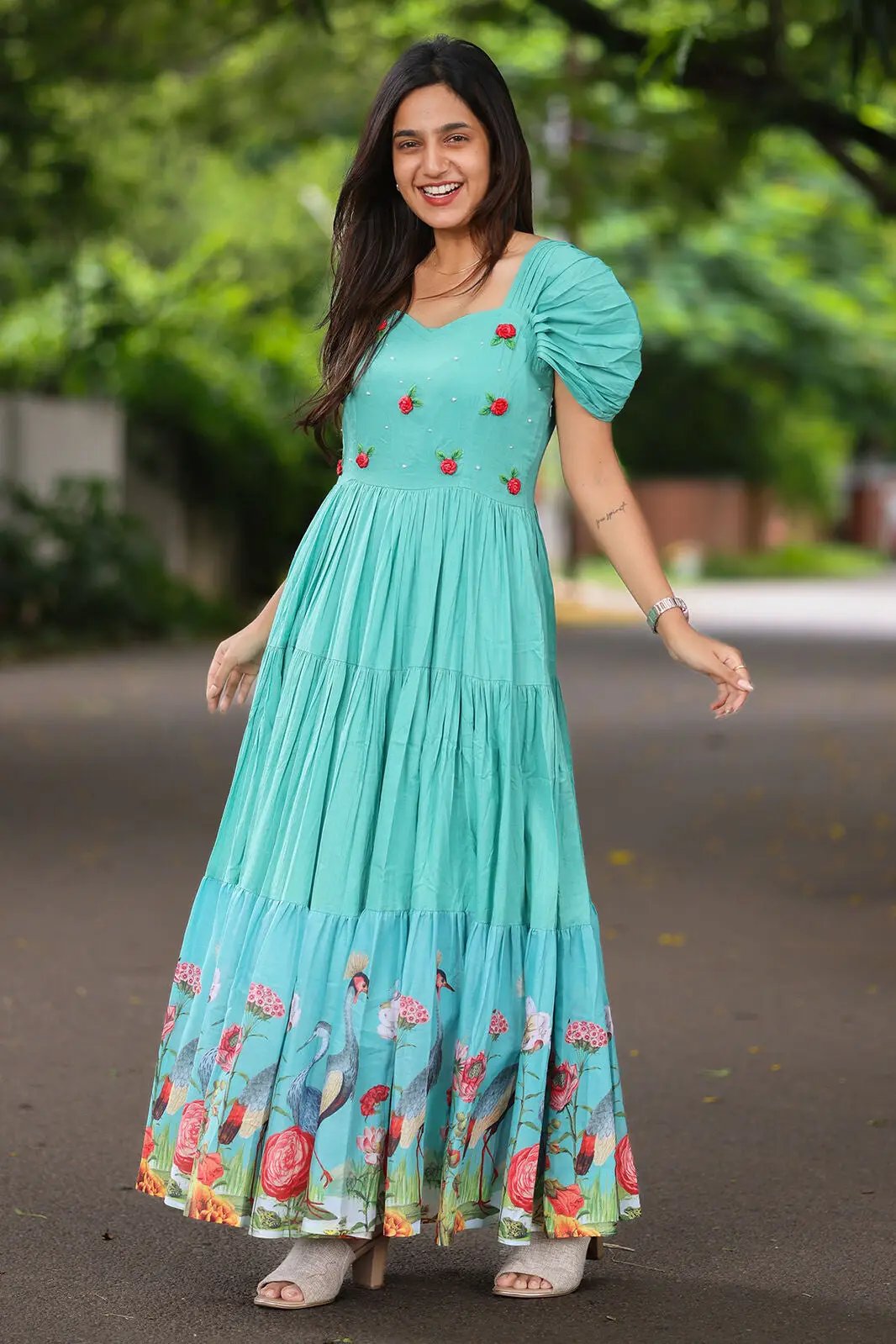 Aqua Tidefall Cotton Midi Dress with colorful floral hem, worn outdoors.