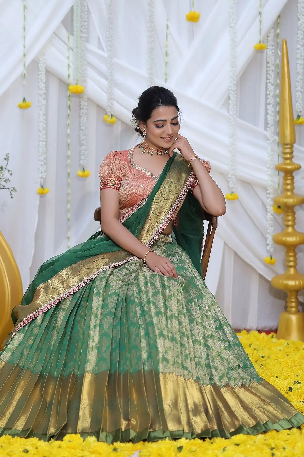 a woman in green lehnga set