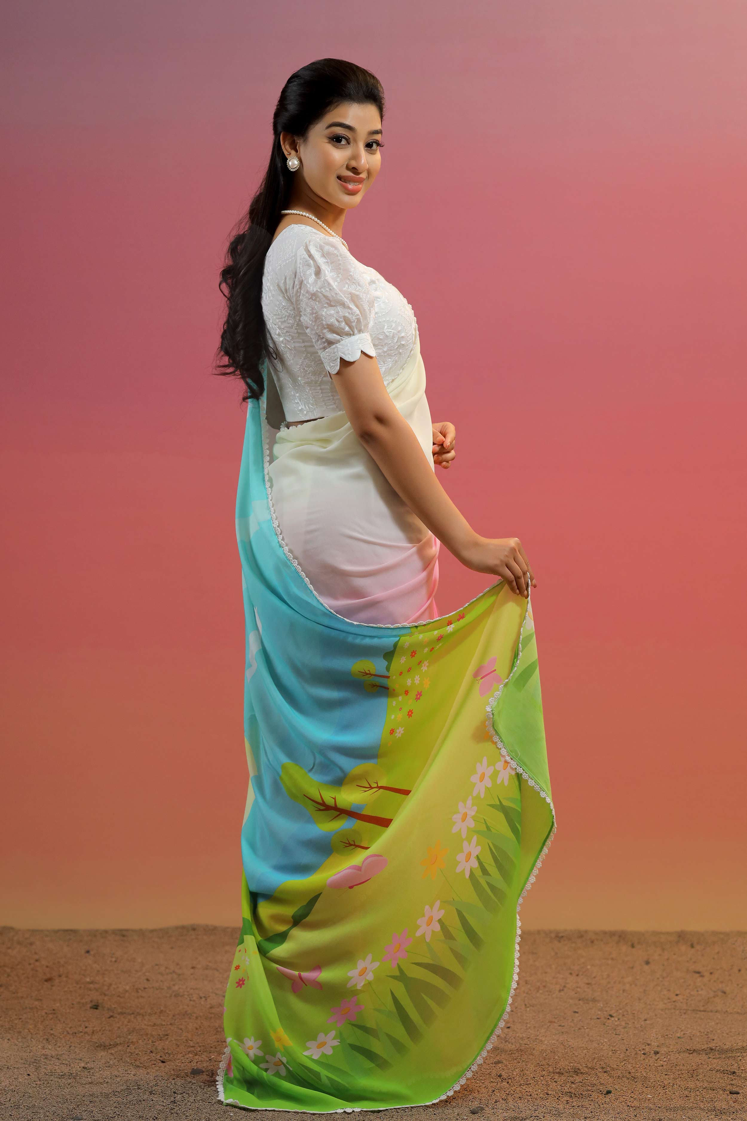 a woman in cotton georgette pink and white saree