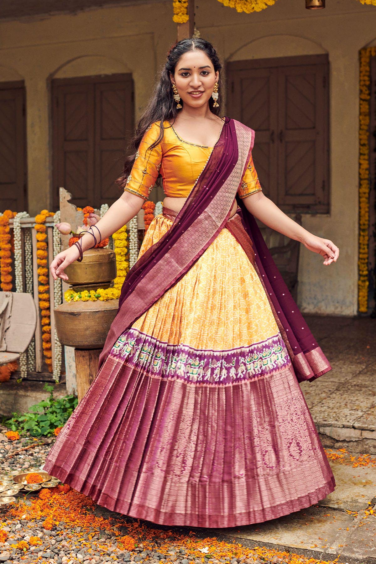 Yellow jacquard pure-silk half-saree,contrast border & blouse of  poun,mayil,muthu & kattu kamalam,intricate zari dhavani