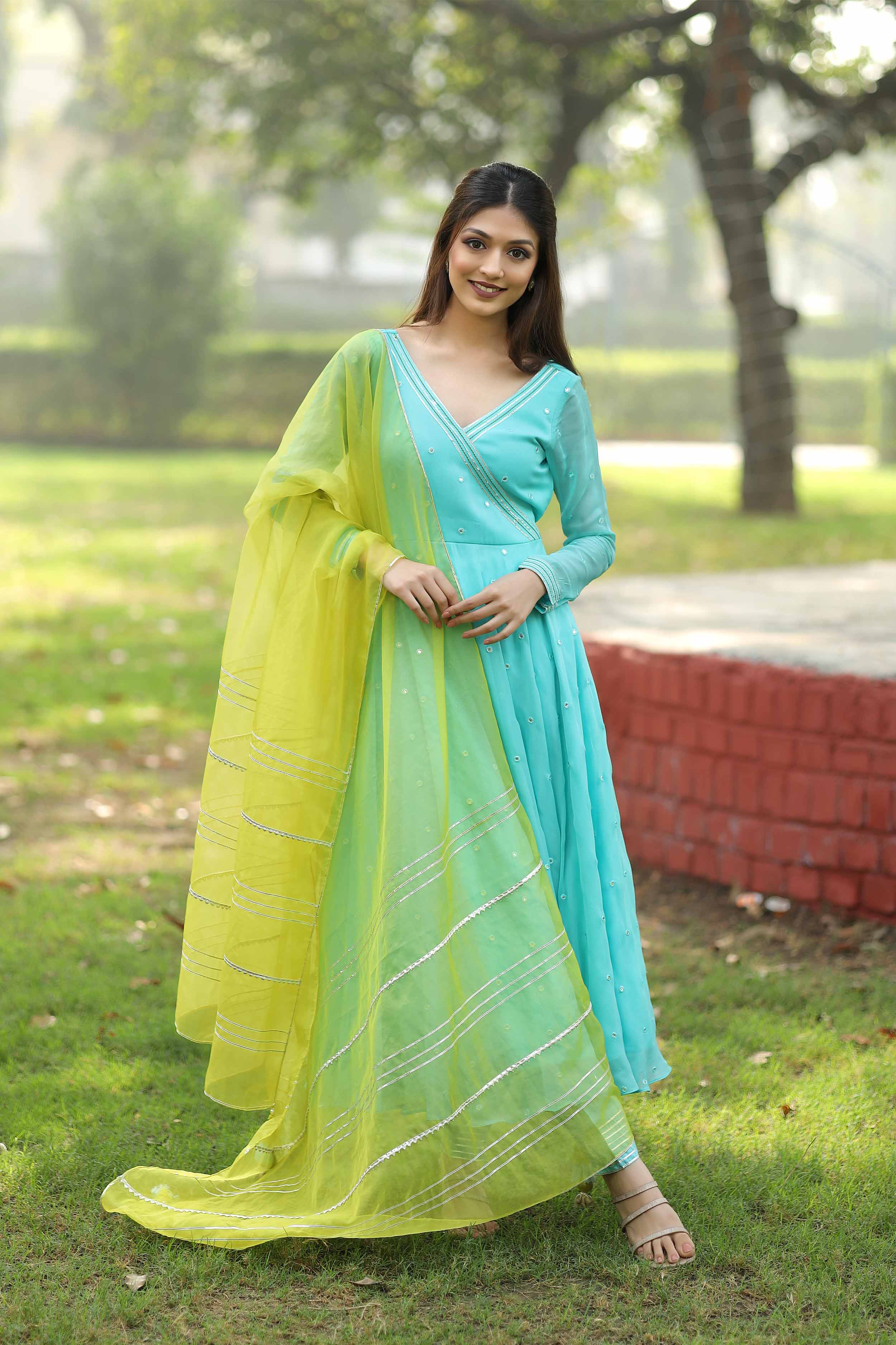 a woman in a blue and yellow dress standing in the grass wearing a dress Victoria Mirror Anarkali Set