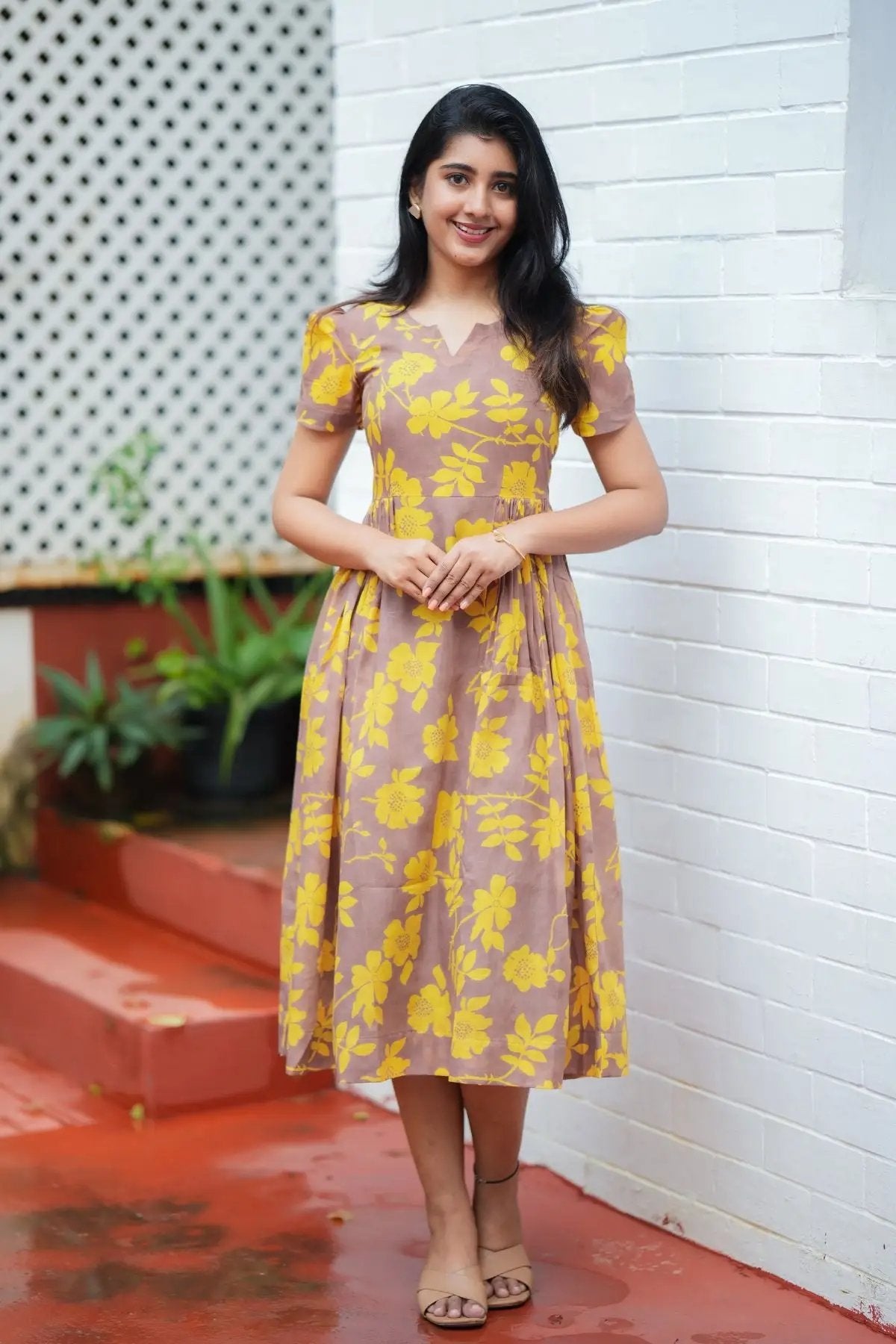 Yelena Midi Dress in yellow floral print with puff sleeves, styled as a kurta and suit set, perfect for summer fashion.