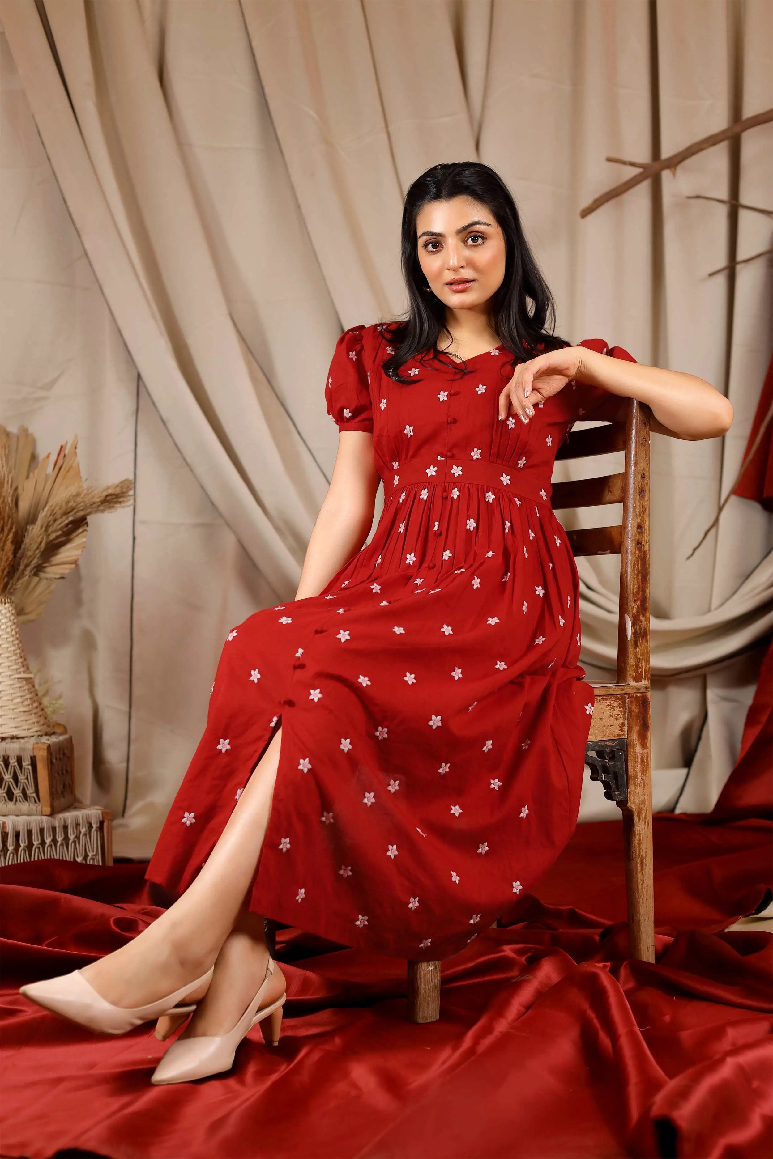 a woman in red midi dress