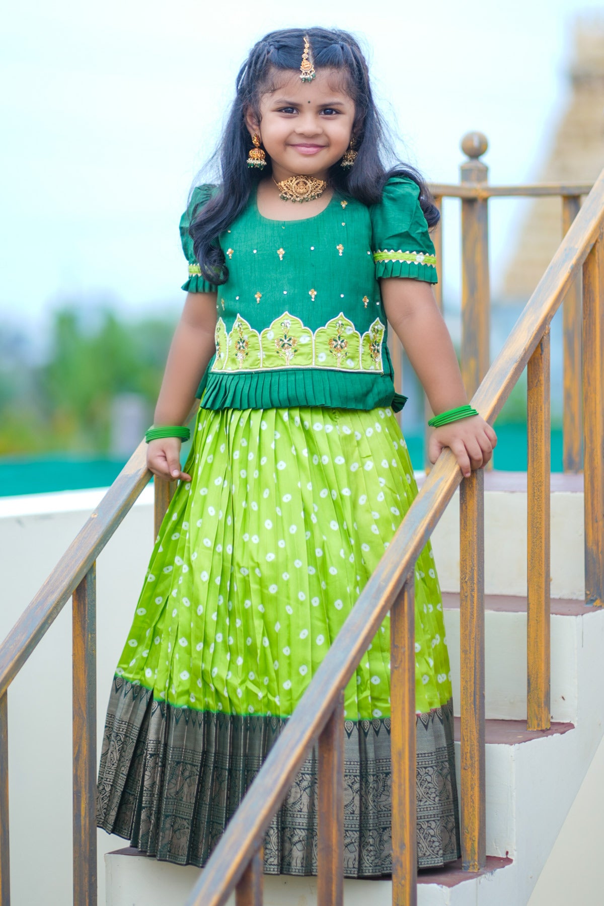 Girl wearing light sea green lehenga on staircase