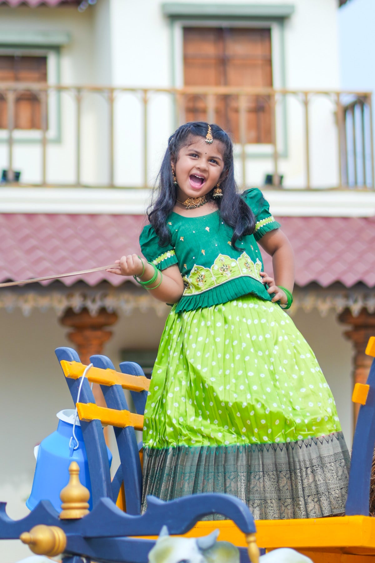 Girl in light sea green lehenga set posing outdoors