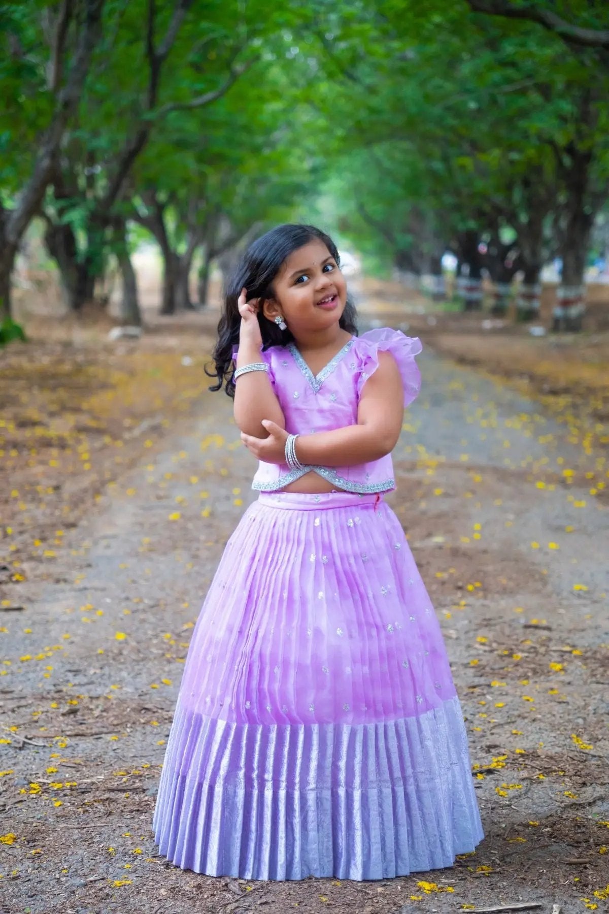 Lavender Baby Siddhi Lehenga Set for kids in a forest setting