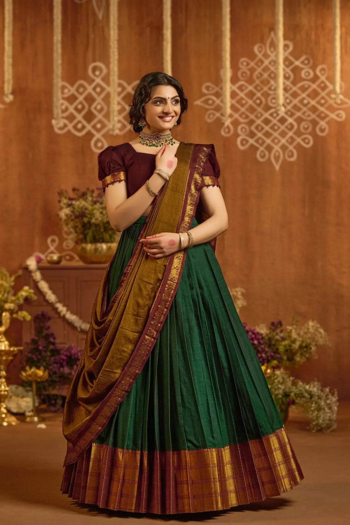 Devara Handloom Lehenga Set in Green with maroon blouse, gold border, and pleated design, styled for traditional occasions.