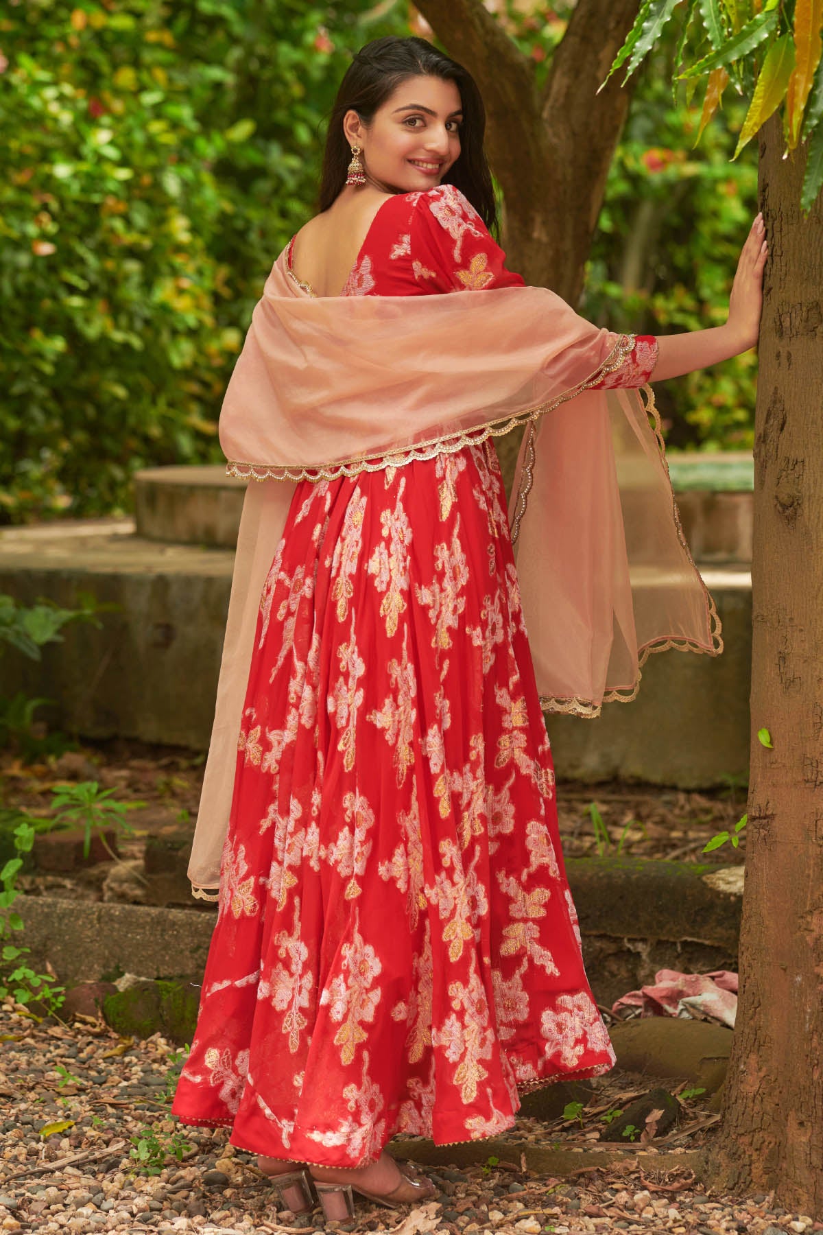 A woman in Red Anakali suit