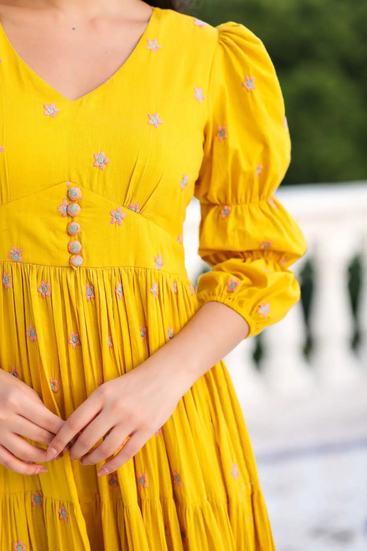 Close-up of yellow Sunshine Maxi Dress with button details