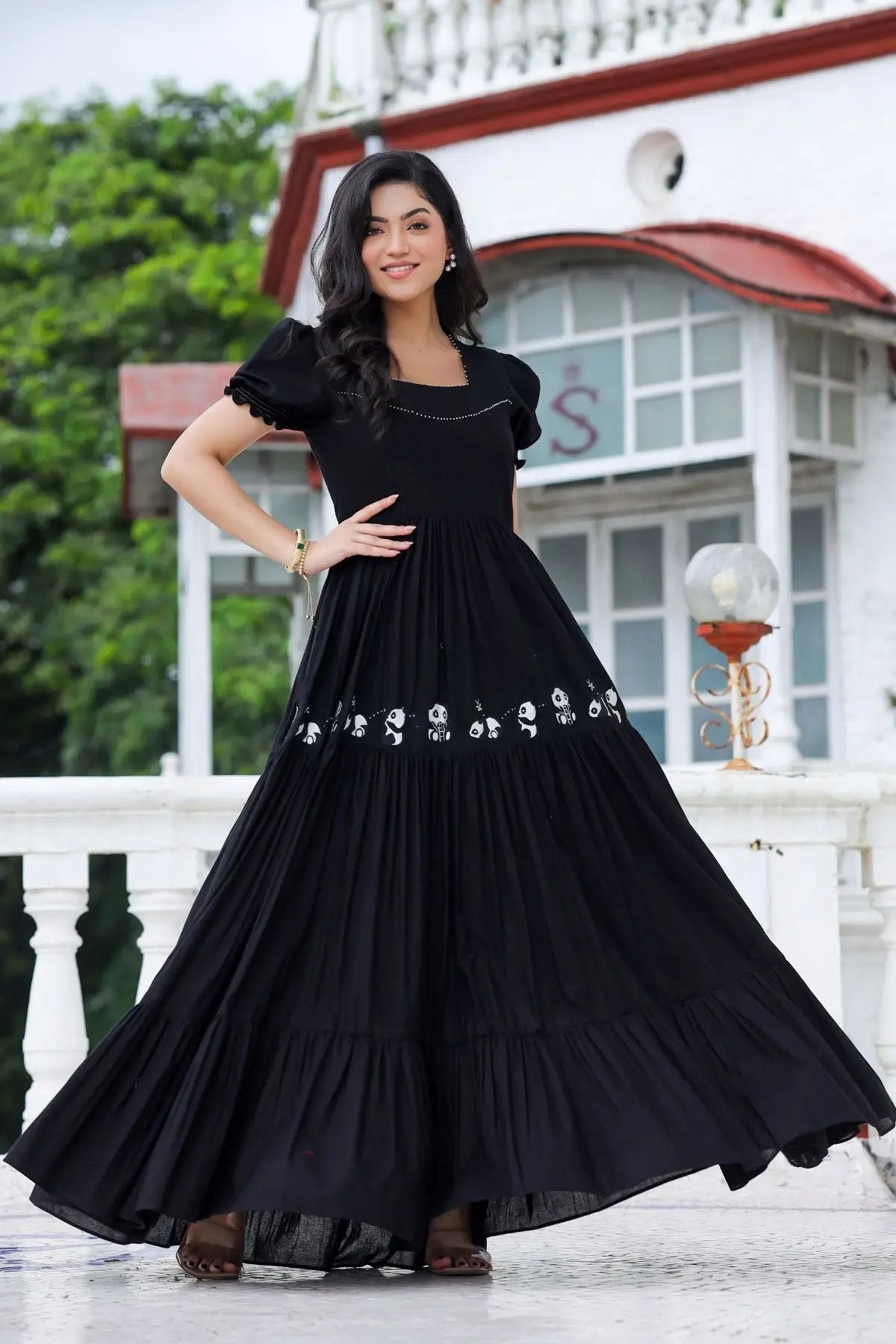 Flowy black maxi dress with intricate design