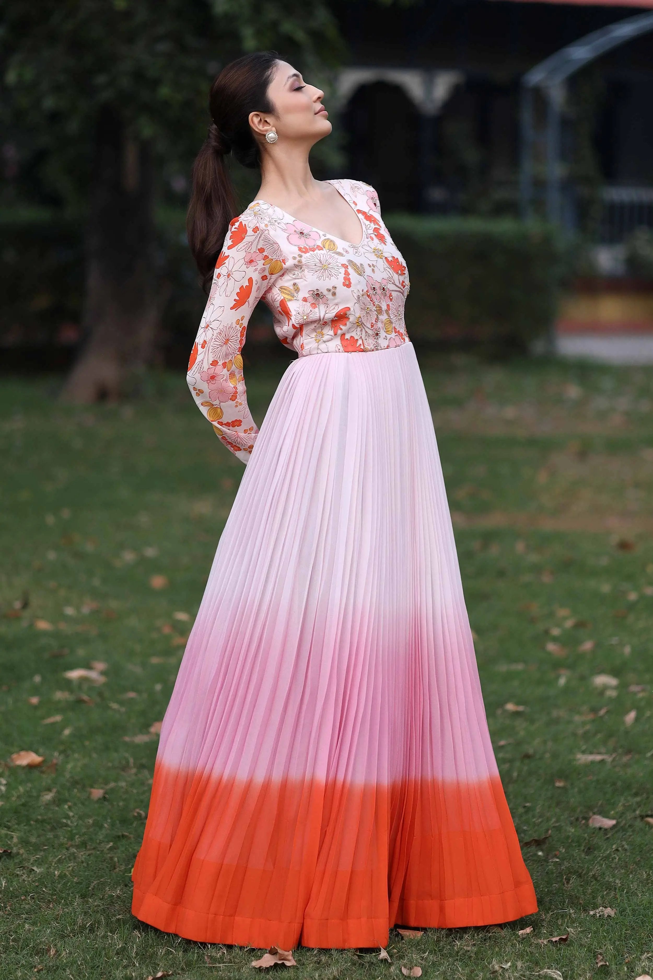 a woman in pink and orange gown