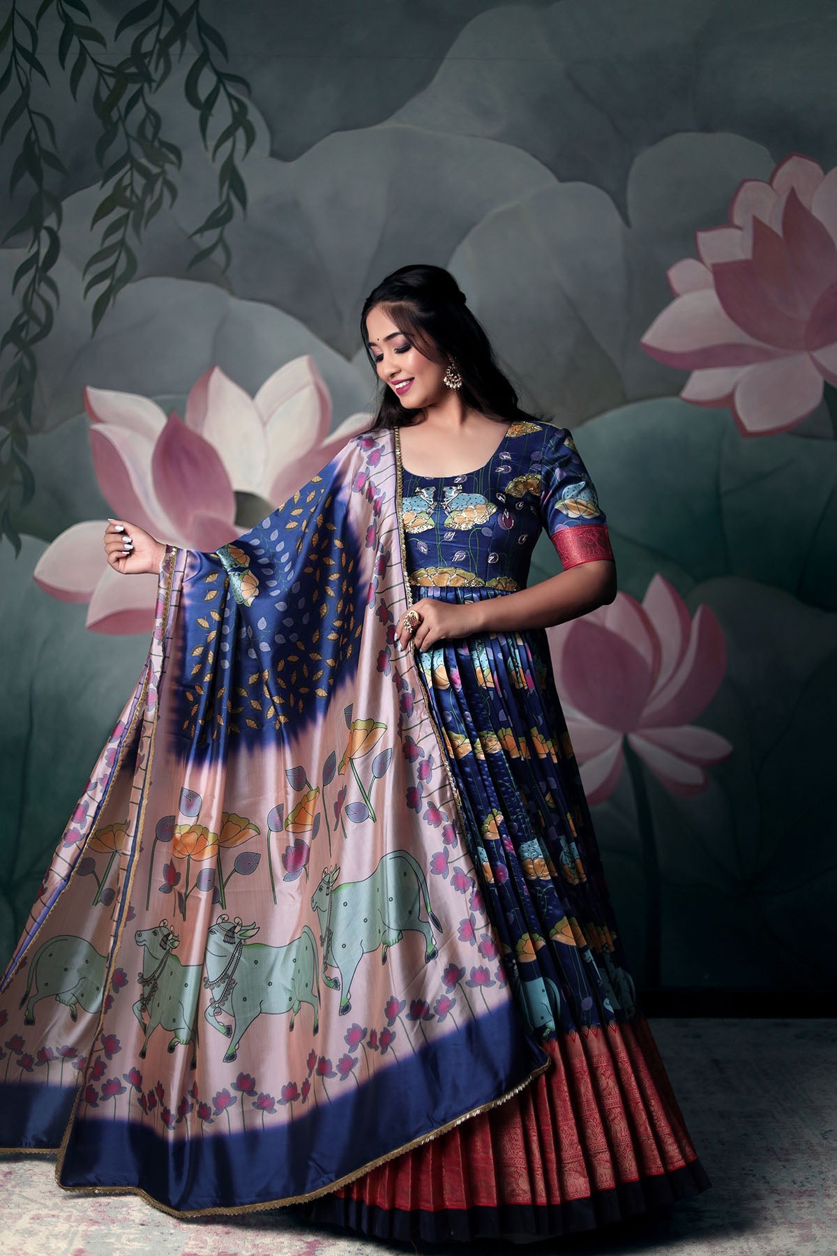 a woman in blue silk dress