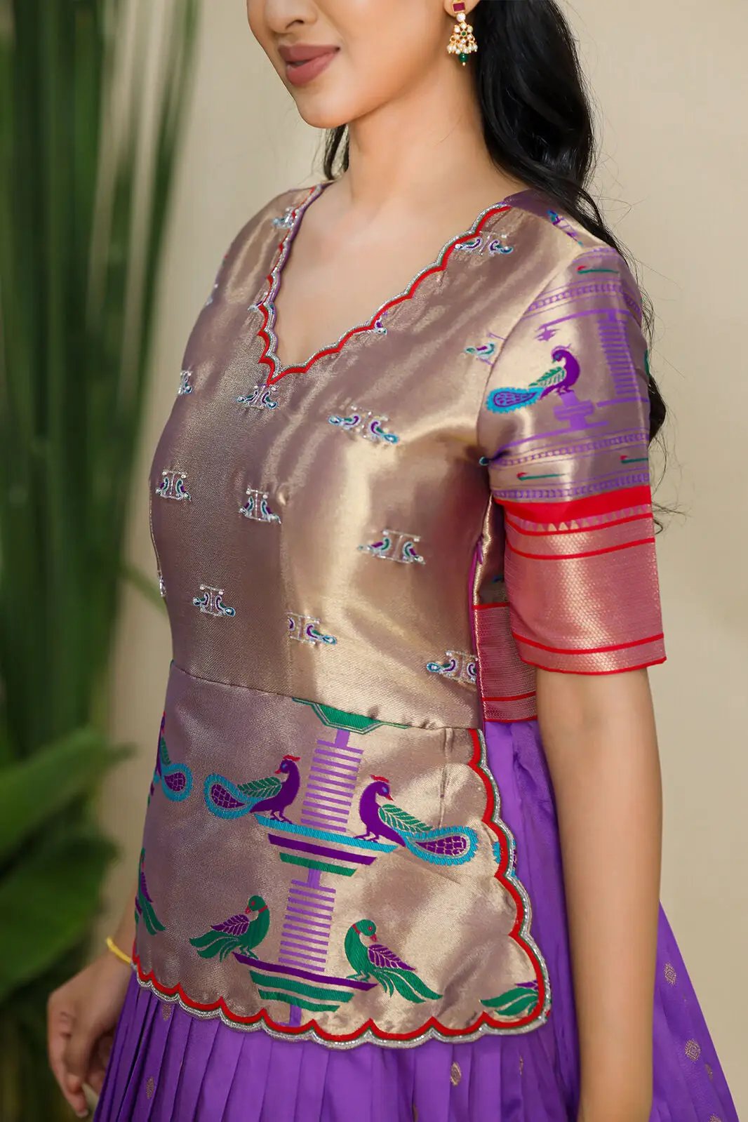 Close-up of Banarasi dress with peacock embroidery